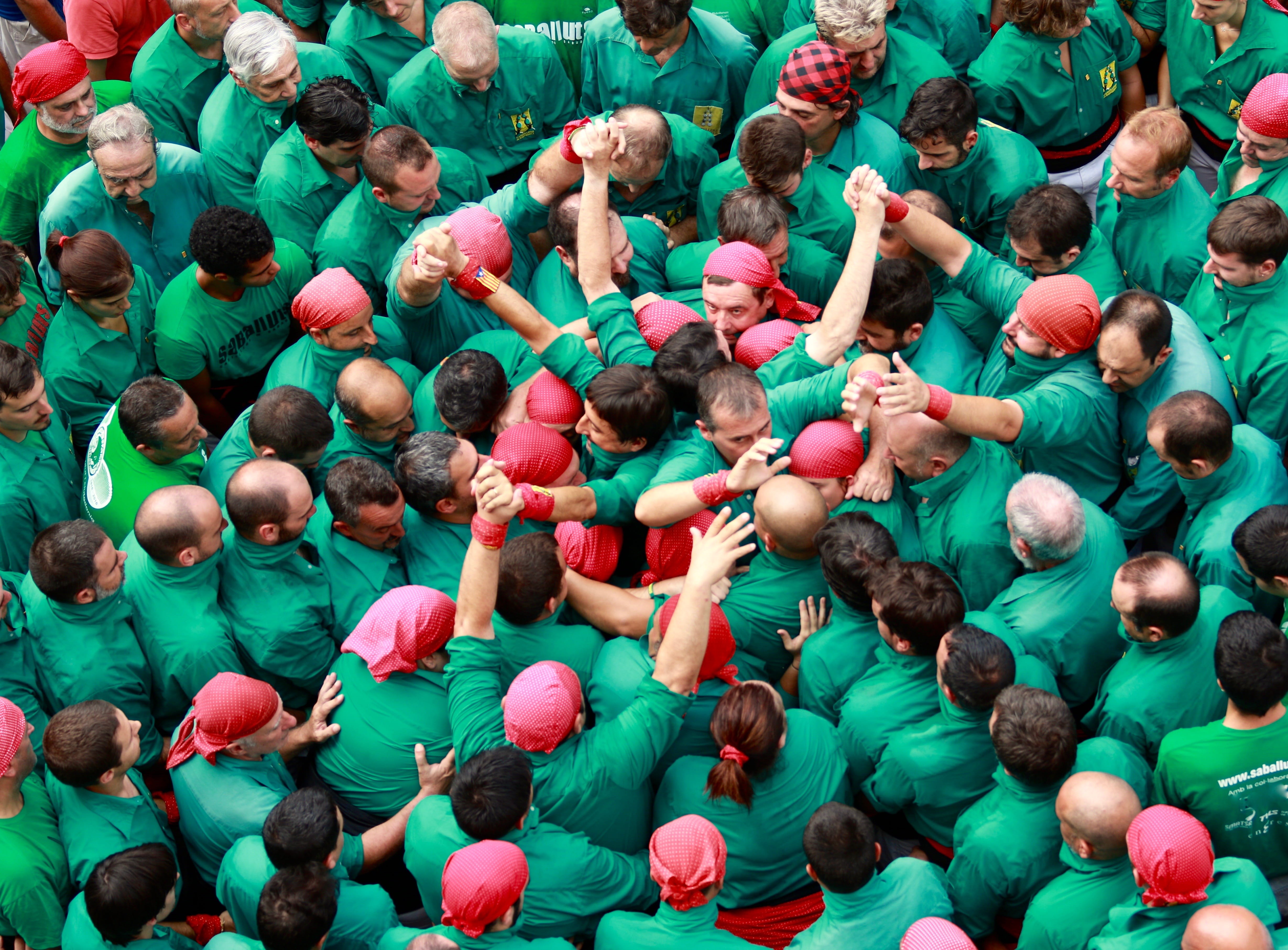 high angle view, green color, arts culture and entertainment, arms raised, men, plaça de sant roc, leisure activity, green, together we create, backgrounds, HD Wallpaper