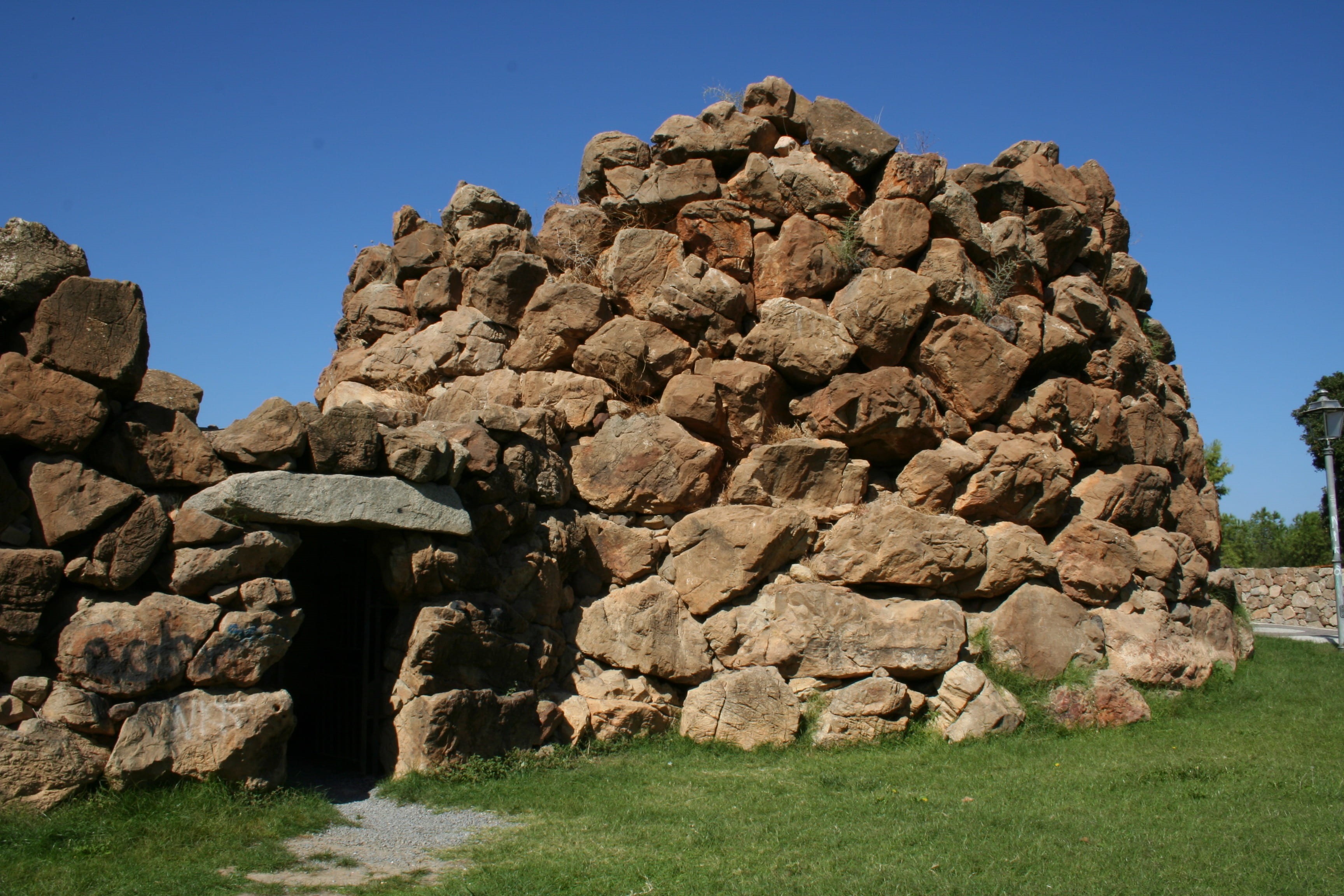 brown, architecture, blue, 2K, stone, clear, nature, land, sunlight, cave, day, stone wall, solid, history, sardinia, plant, built structure, sky, rock - object, HD Wallpaper
