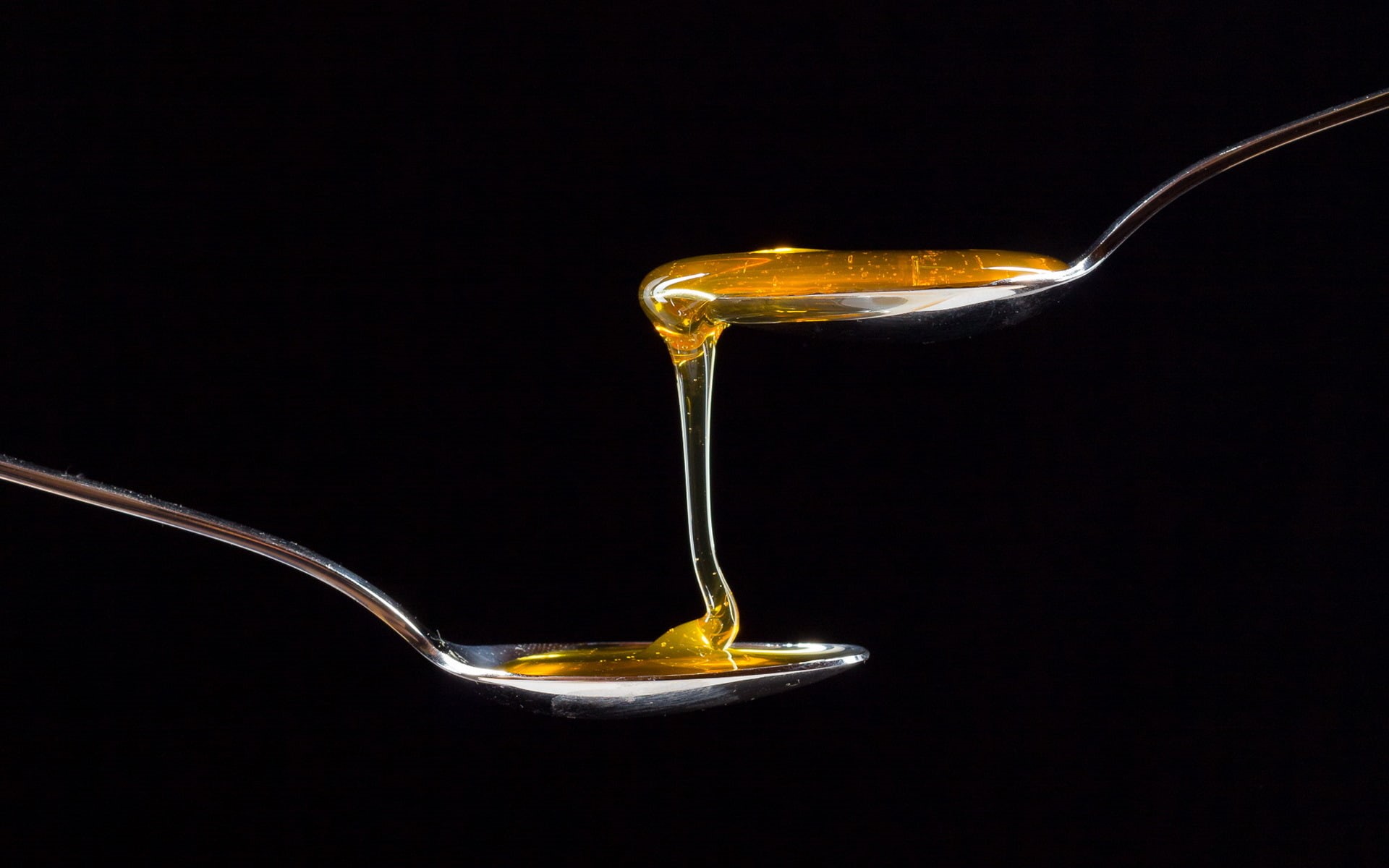 black background, black, gold colored, motion, spoon, eating utensil, sweet food, gold, indulgence, close-up, honey, pouring, indoors, falling, no people, HD Wallpaper