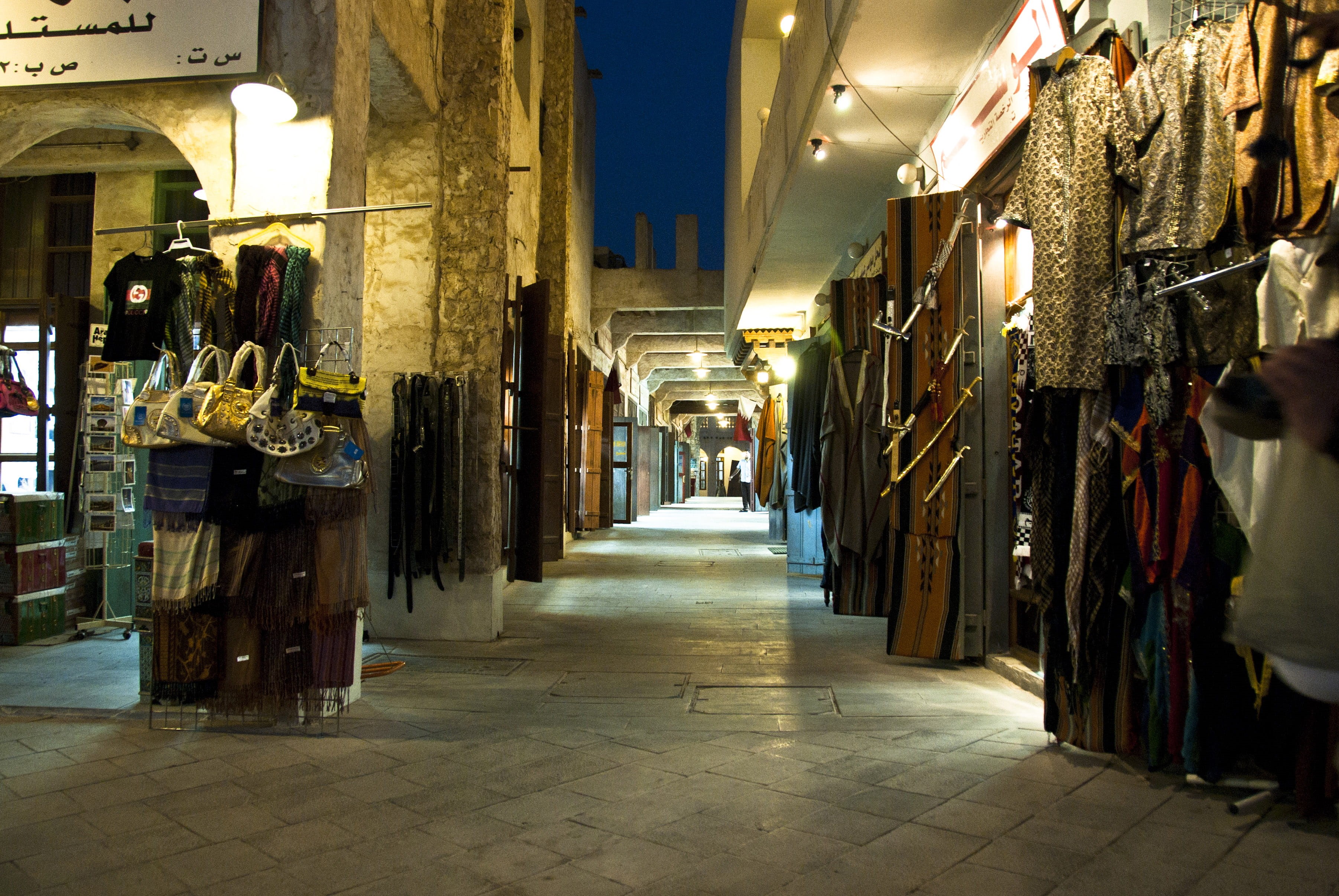 illuminated, clothing, waqif, night, photos, market stall, sale, street market, Qatar, building, alley, shops, no people, city, built structure, public domain, HD Wallpaper