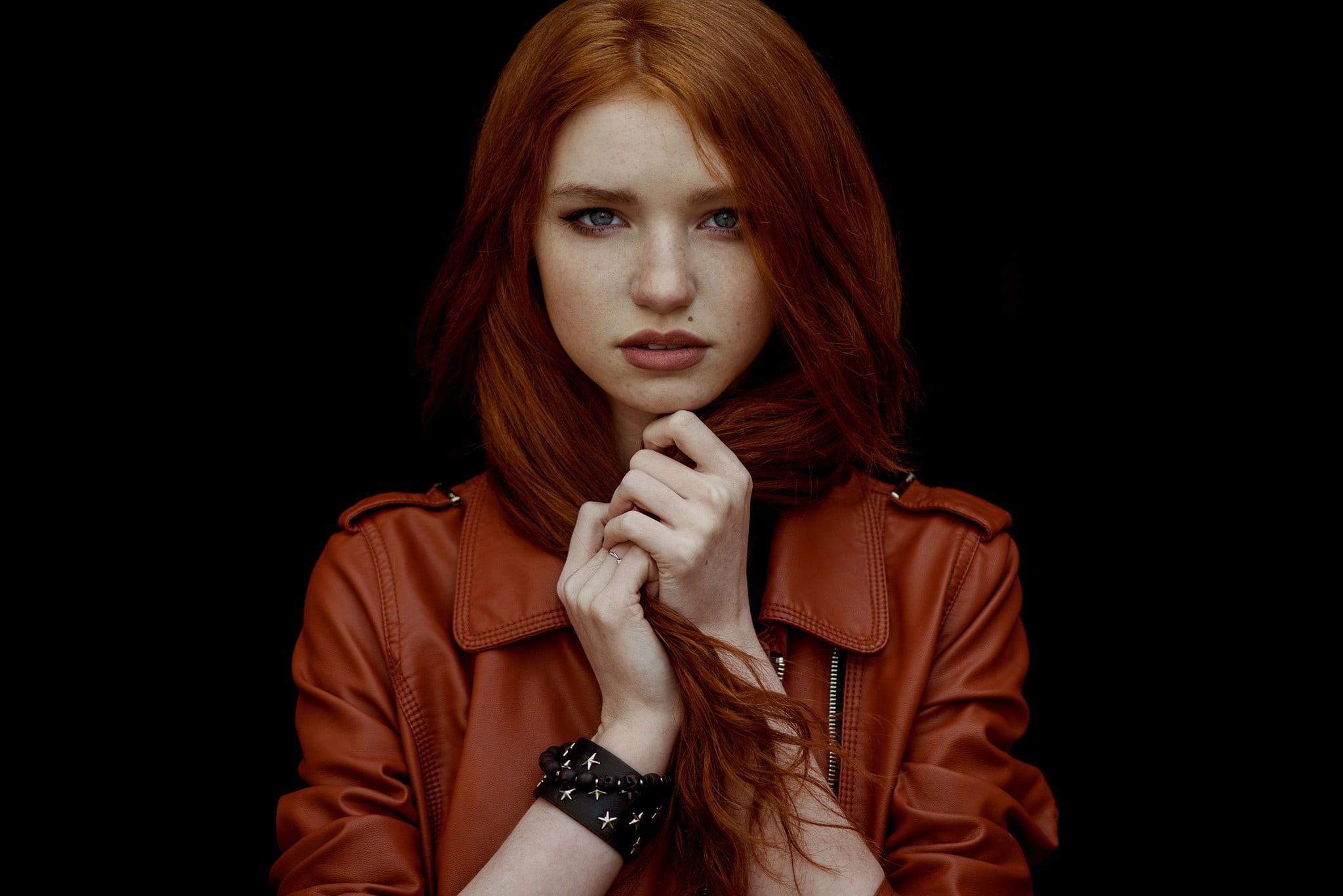 adult, black background, casual clothing, one person, face, front view, hood - clothing, studio shot, leather jackets, bangs, beautiful woman, young adult, HD Wallpaper