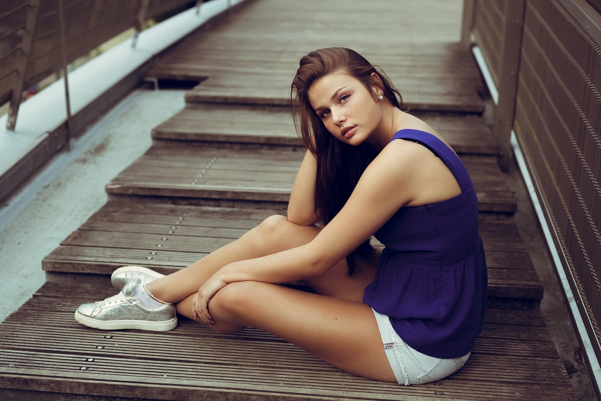 teenager, relaxation, purple clothing, looking over shoulder, wooden surface, young adult, beautiful woman, on the floor, young women, brown hair, brunette, HD Wallpaper