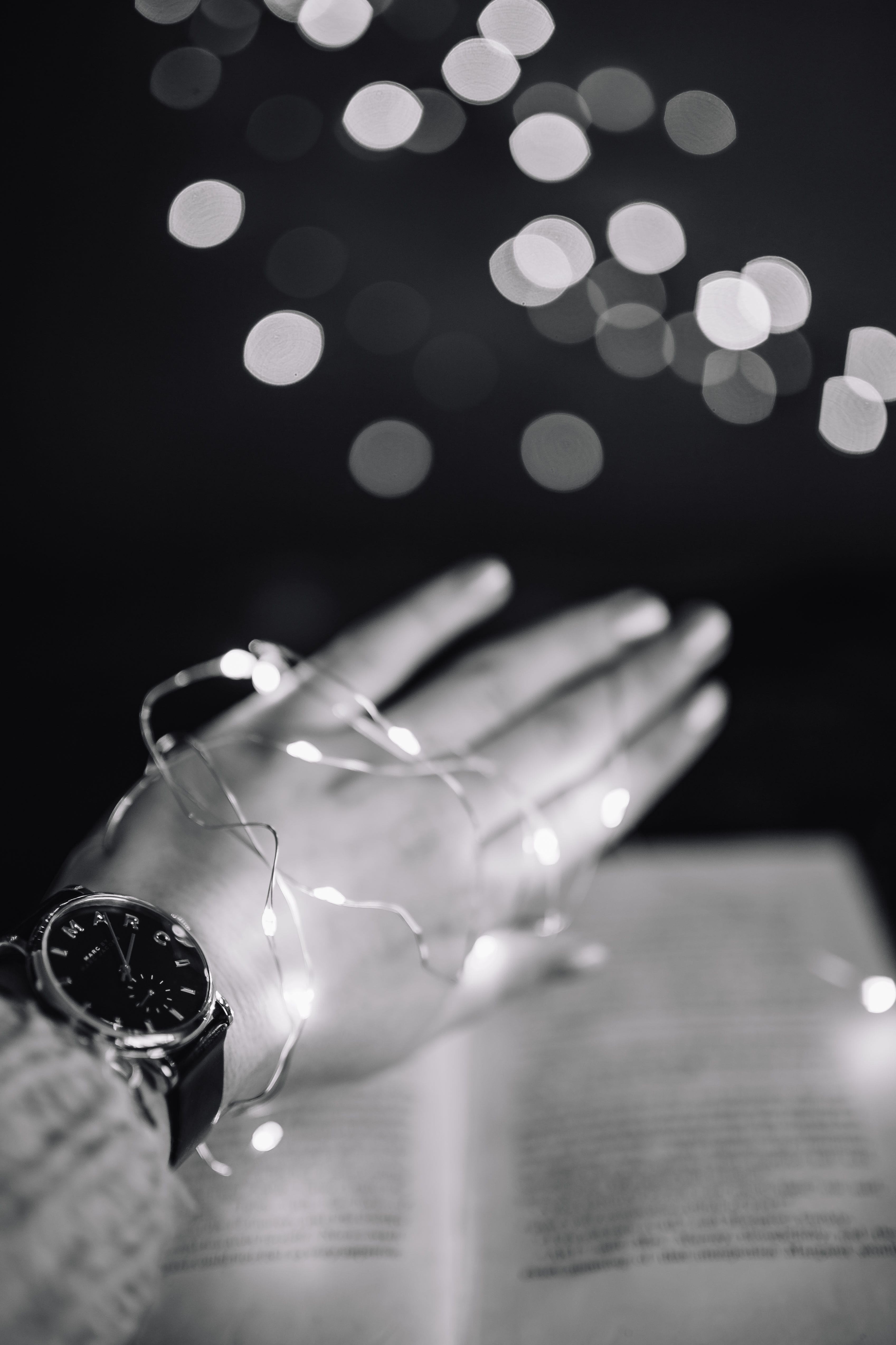 defocused, glowing, night, one person, glass, human Hand, table, light - natural phenomenon, indoors, no people, human body part, Fairy Lights, selective focus, Phone HD Wallpaper