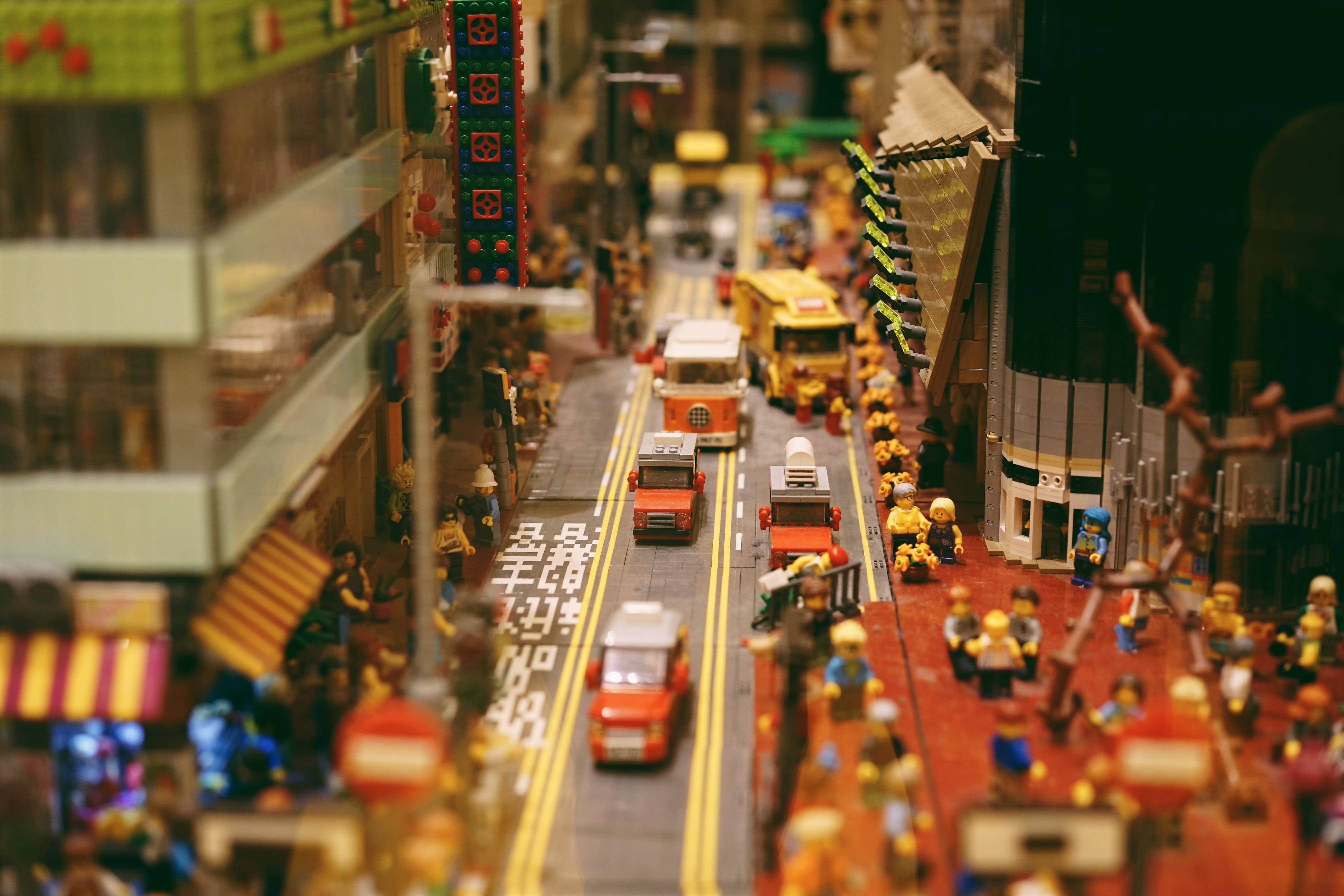 multicolored, car, street, plant, city street, tilt-shift, toy, blur, crowd, incidental people, road, traffic, market, building, orange, miniature, architecture, HD Wallpaper