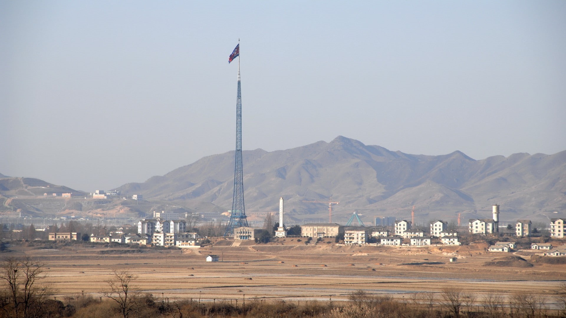 land, built structure, day, mountain range, DPRK, architecture, 1080P, flag, religion, beauty in nature, nature, building, mountain, North Korea, scenics - nature, HD Wallpaper