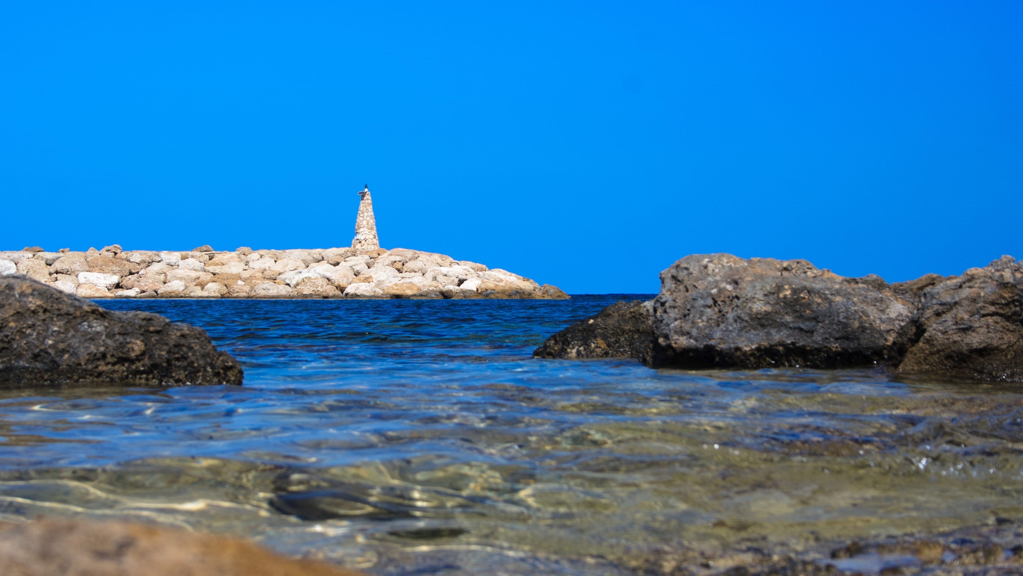 solid, water, ocean, House, blue, rocks, building exterior, summer, architecture, small, Lighthouse, coast, rock, built structure, copy space, nature, sea, HD Wallpaper