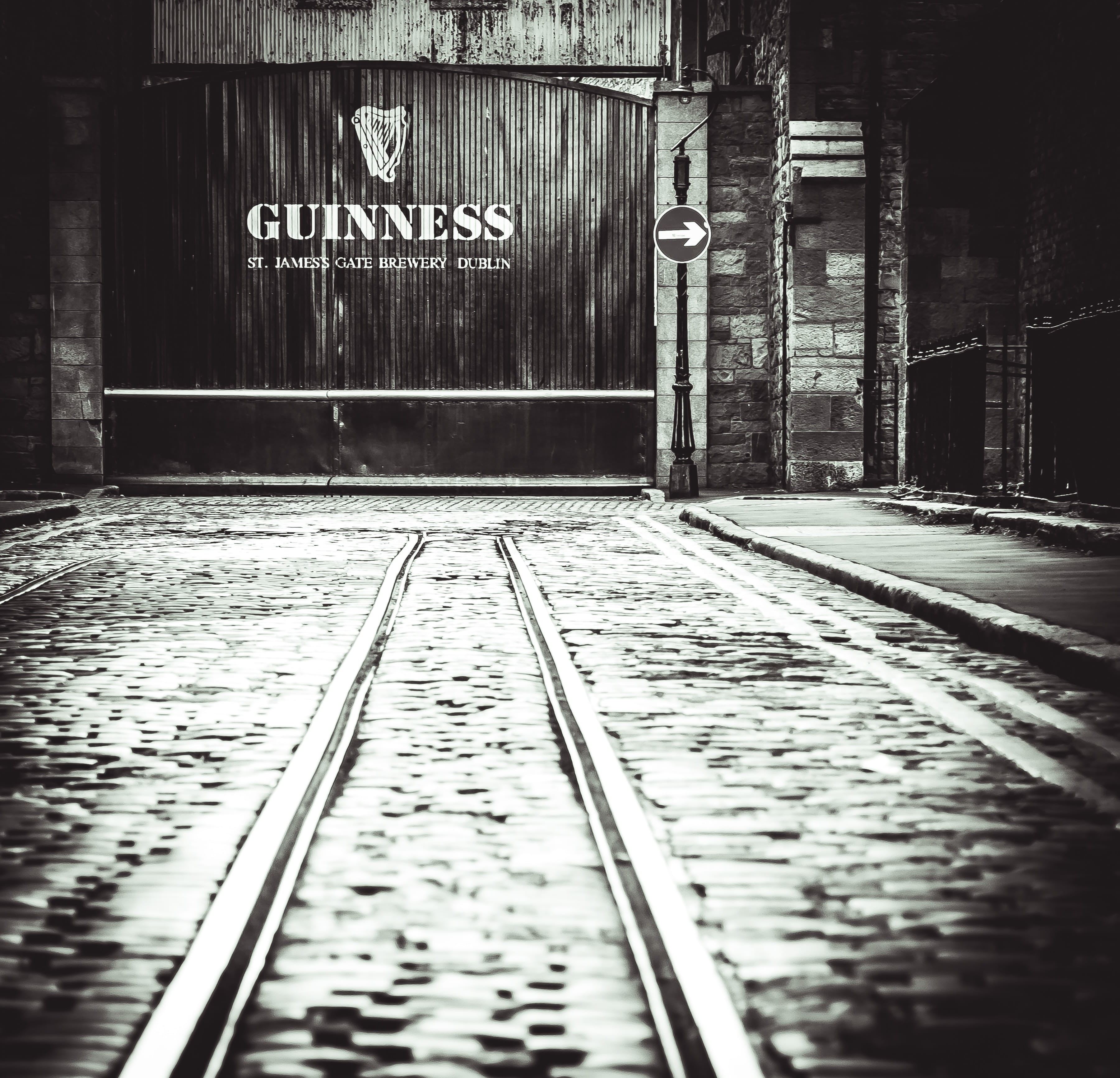 railroad track, direction, street, building exterior, track, the warehouse, architecture, alley, dublin, information, guinness, western script, the way forward, HD Wallpaper
