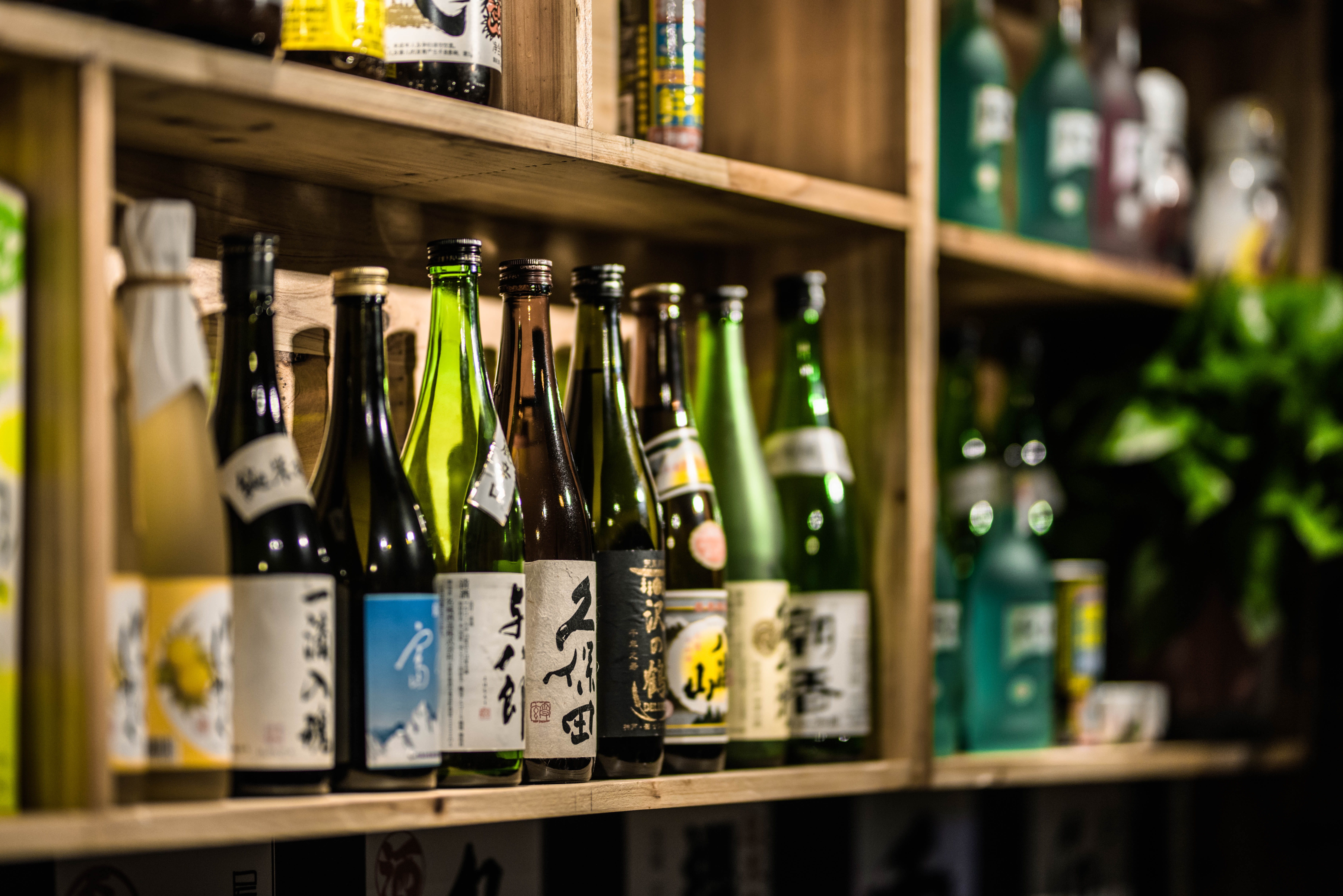 sake, pub, drink, liquor store, no people, arrangement, beer, beer bottle, retail, alcohol, human, wine, large group of objects, beverage, furniture, person, HD Wallpaper