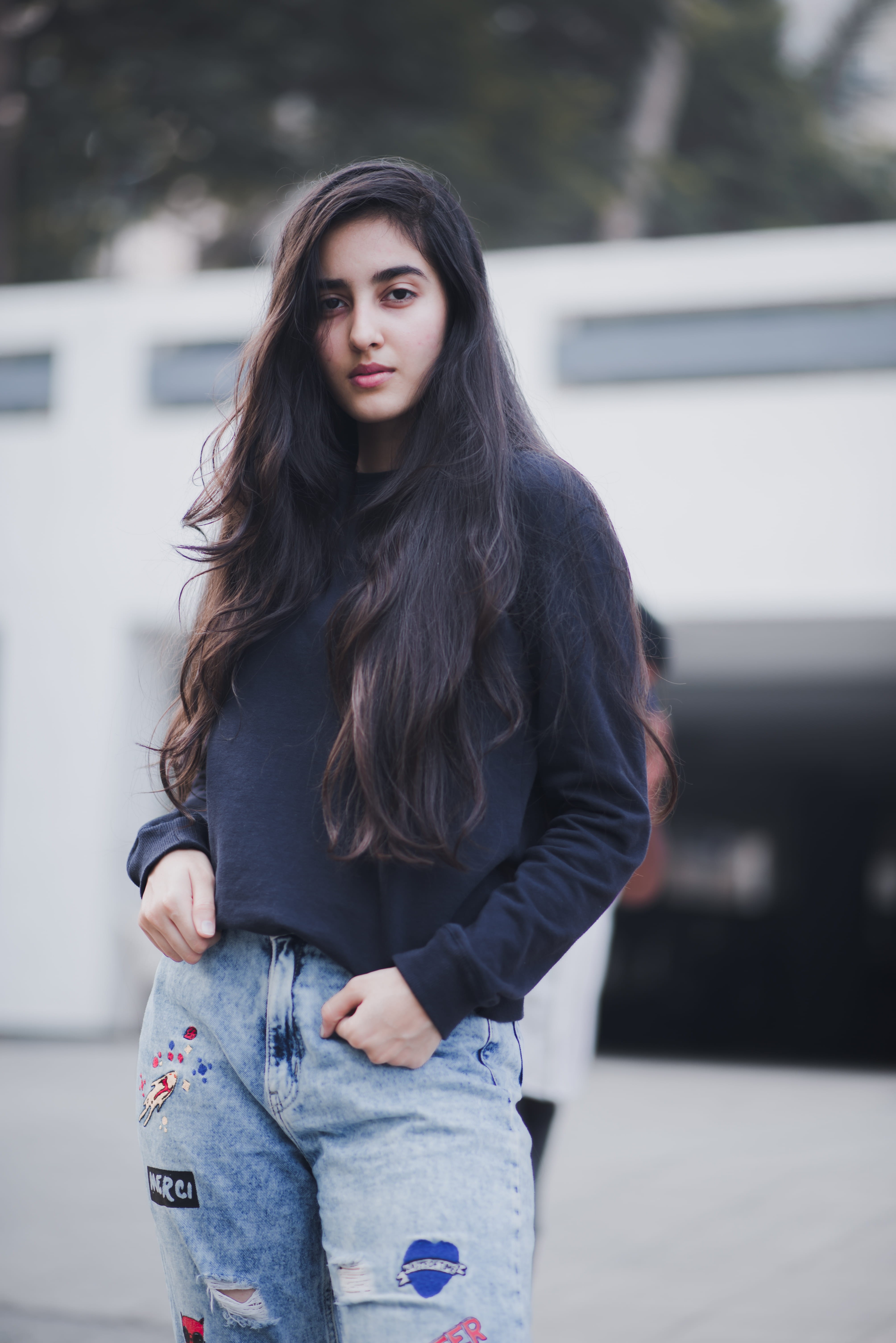 female, lady, hair, india, top, jeans, black, look, young women, three quarter length, jumper, teenager, portrait, looking at camera, street, 5K, outdoors, Phone HD Wallpaper