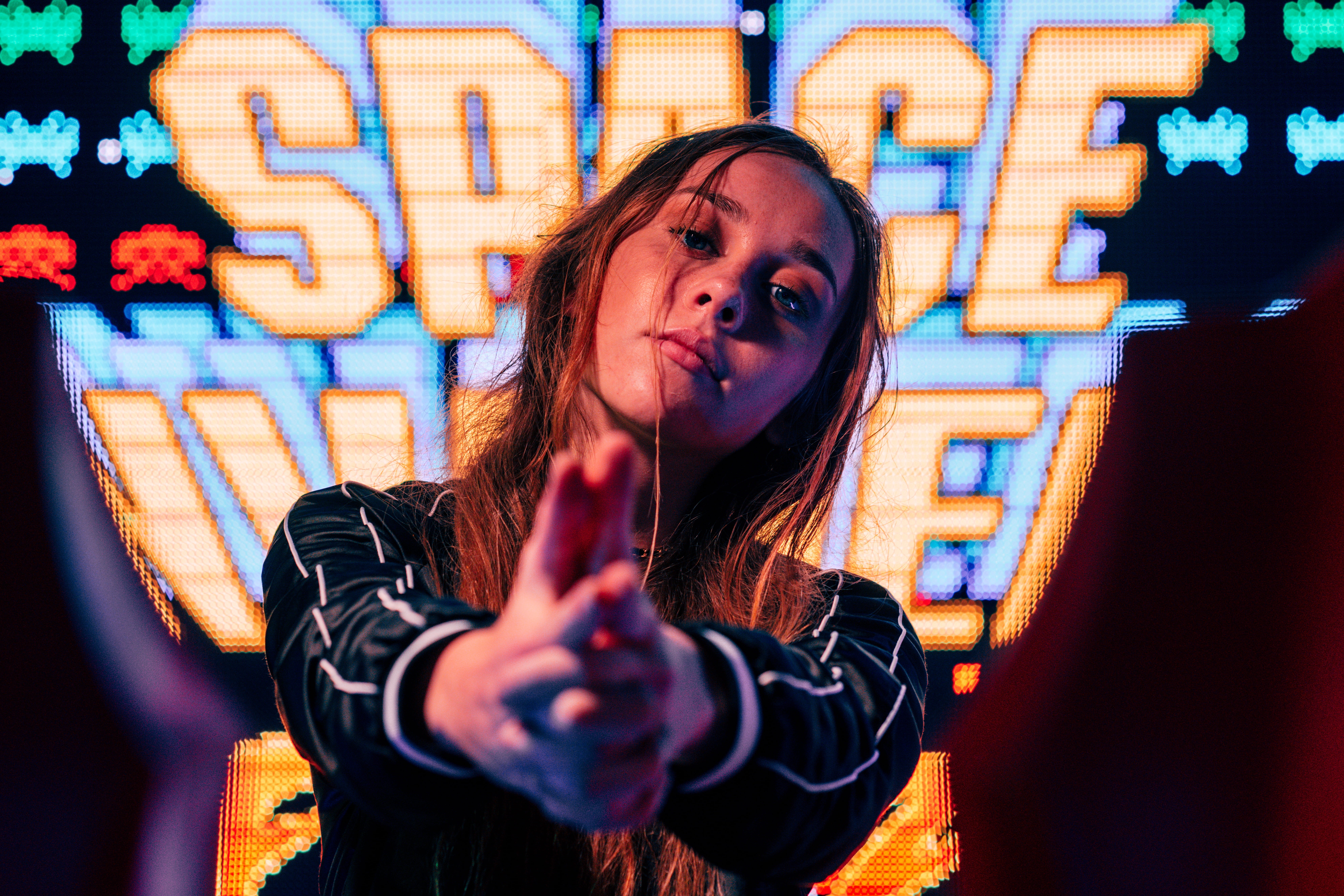 young, smiling, closeup, cheerful, neon, one Person, gamer, dark, focused, adult, finger, videogame, caucasian Ethnicity, happiness, long hair, gaming, HD Wallpaper
