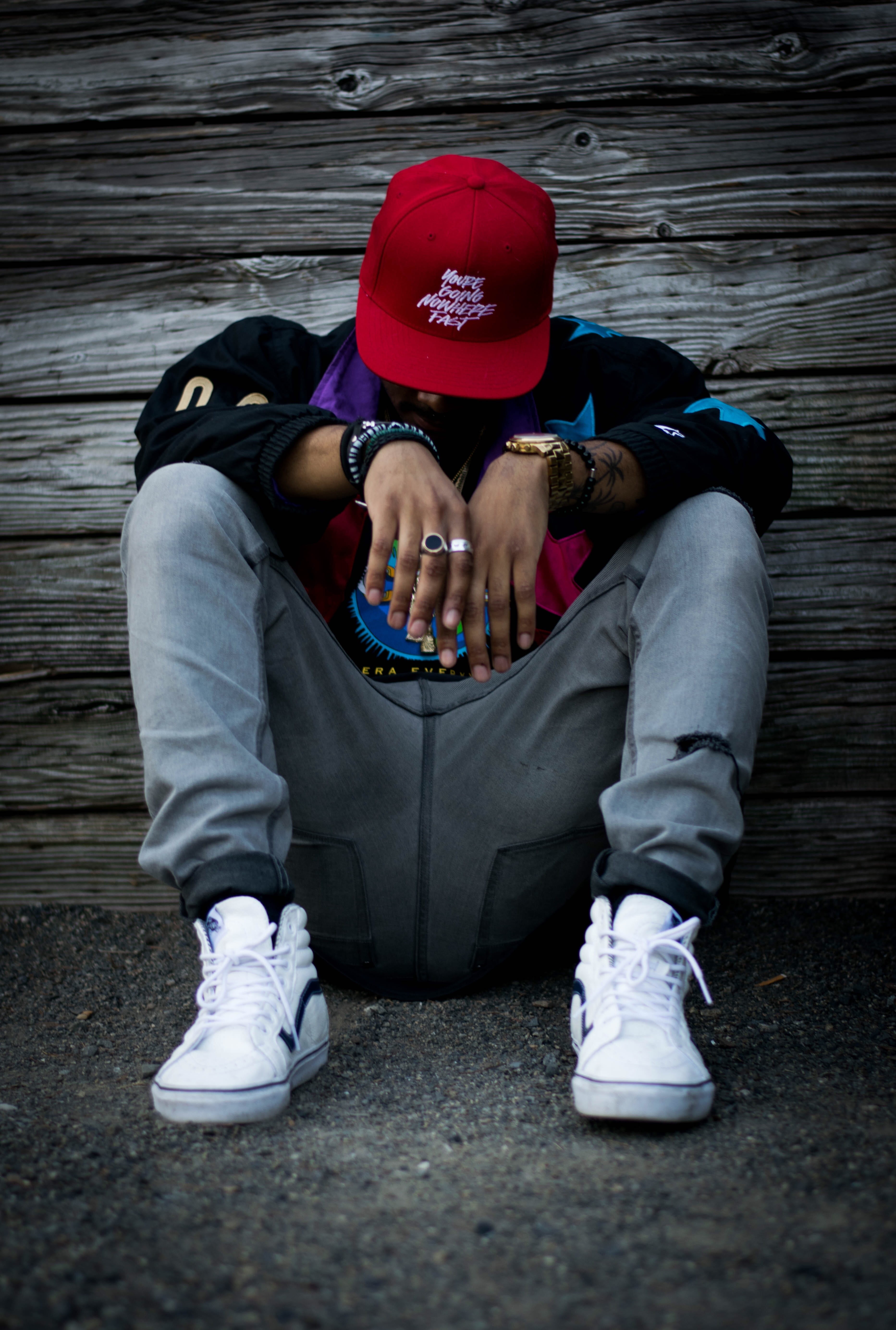 man, full length, male, sitting, low, cap, hat, white, top, mood, real people, casual clothing, positive emotion, sneaker, obscured face, leisure activity, Phone HD Wallpaper