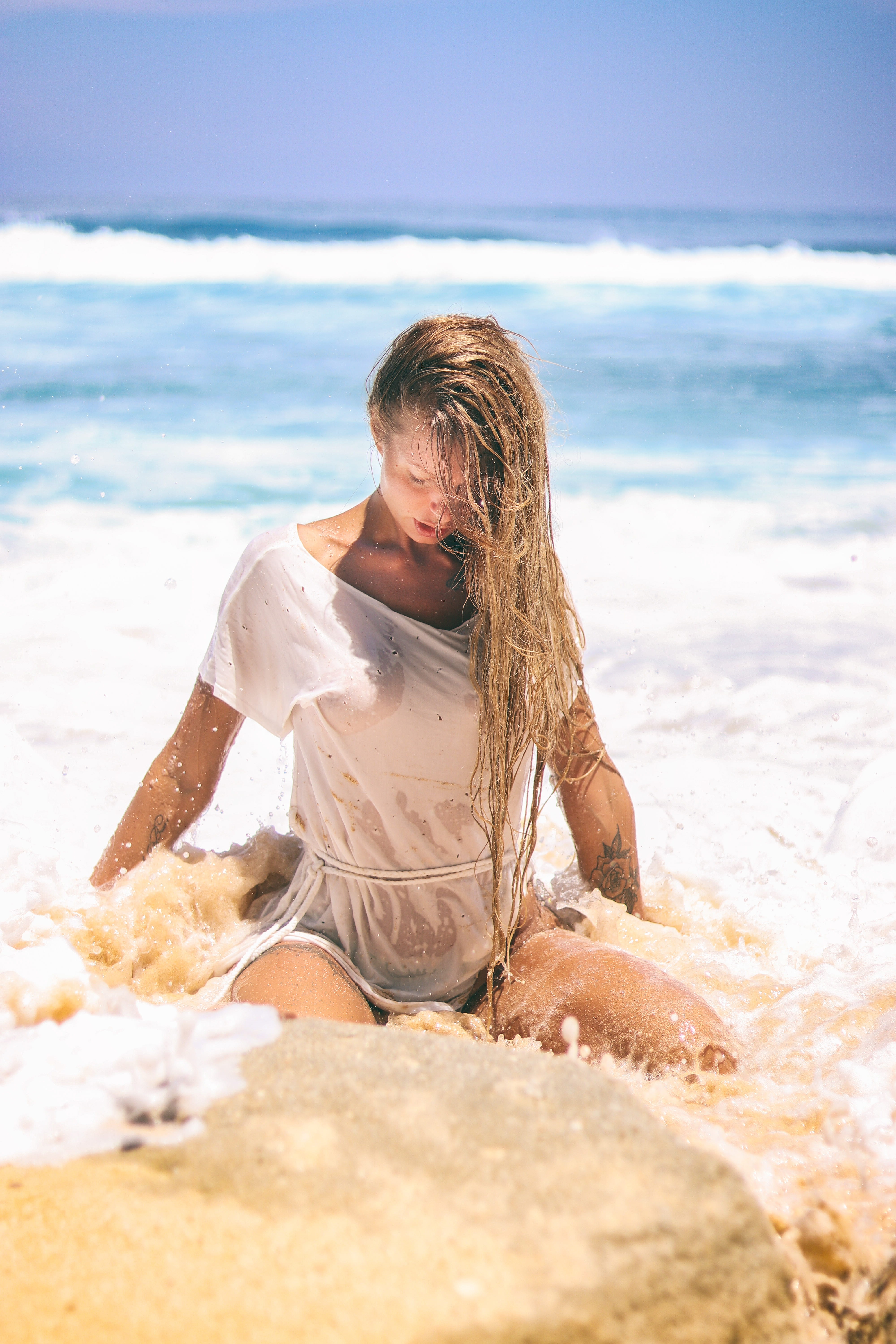 near, top, land, daytime, seashore, one person, woman, wet t-shirt, dom, model, summer, portrait, hairstyle, sun, ocean, sitting, young women, young adult, Phone HD Wallpaper