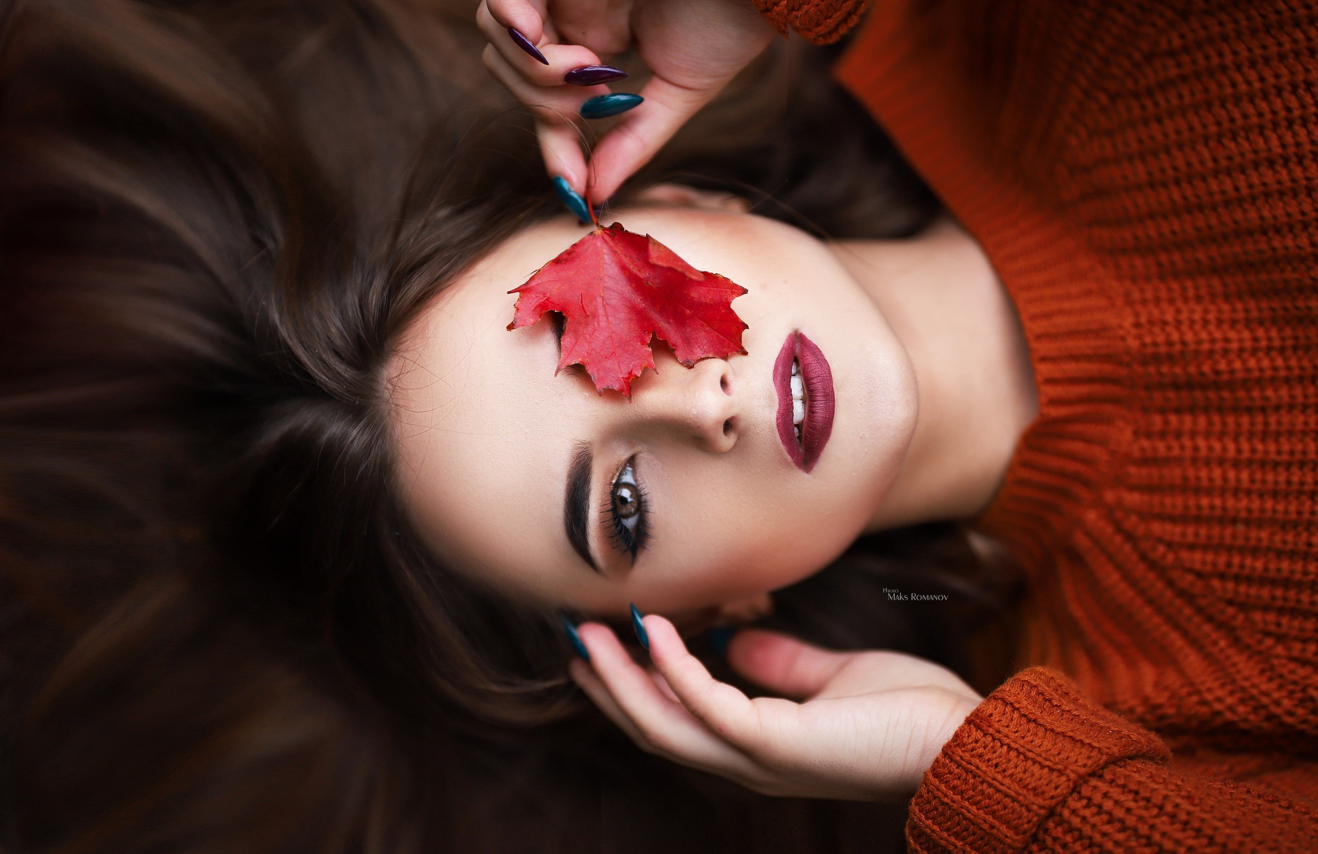 red leaves, top view, Maksim Romanov, red lipstick, leaves, portrait, brunette, makeup, women, model, sweater, face, 2K, brown eyes, HD Wallpaper