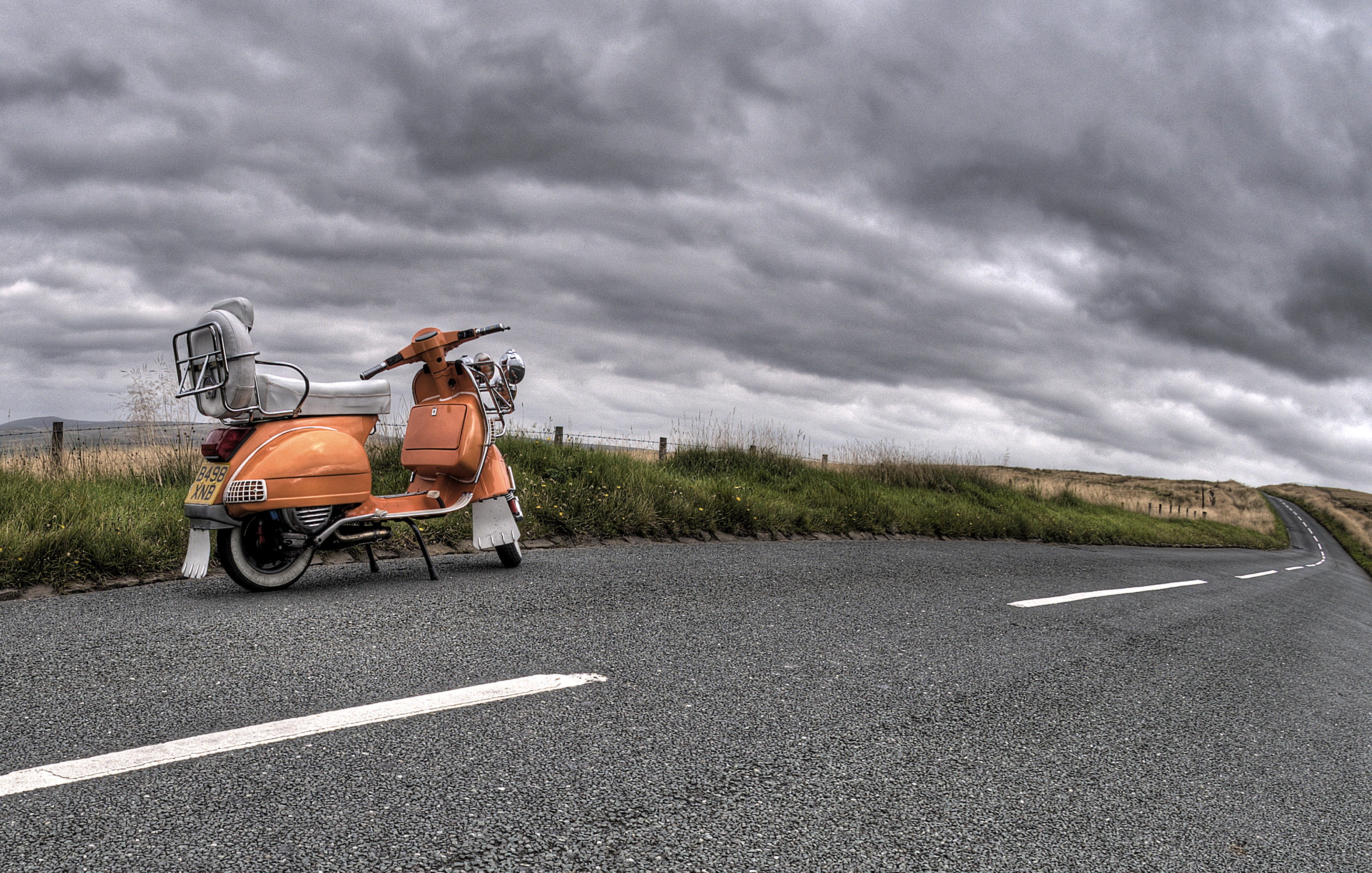 road, city, symbol, vintage, street, motorcycle, grass, overcast, people, public domain images, clouds, motion, road marking, asphalt, sky, nature, adult, HD Wallpaper