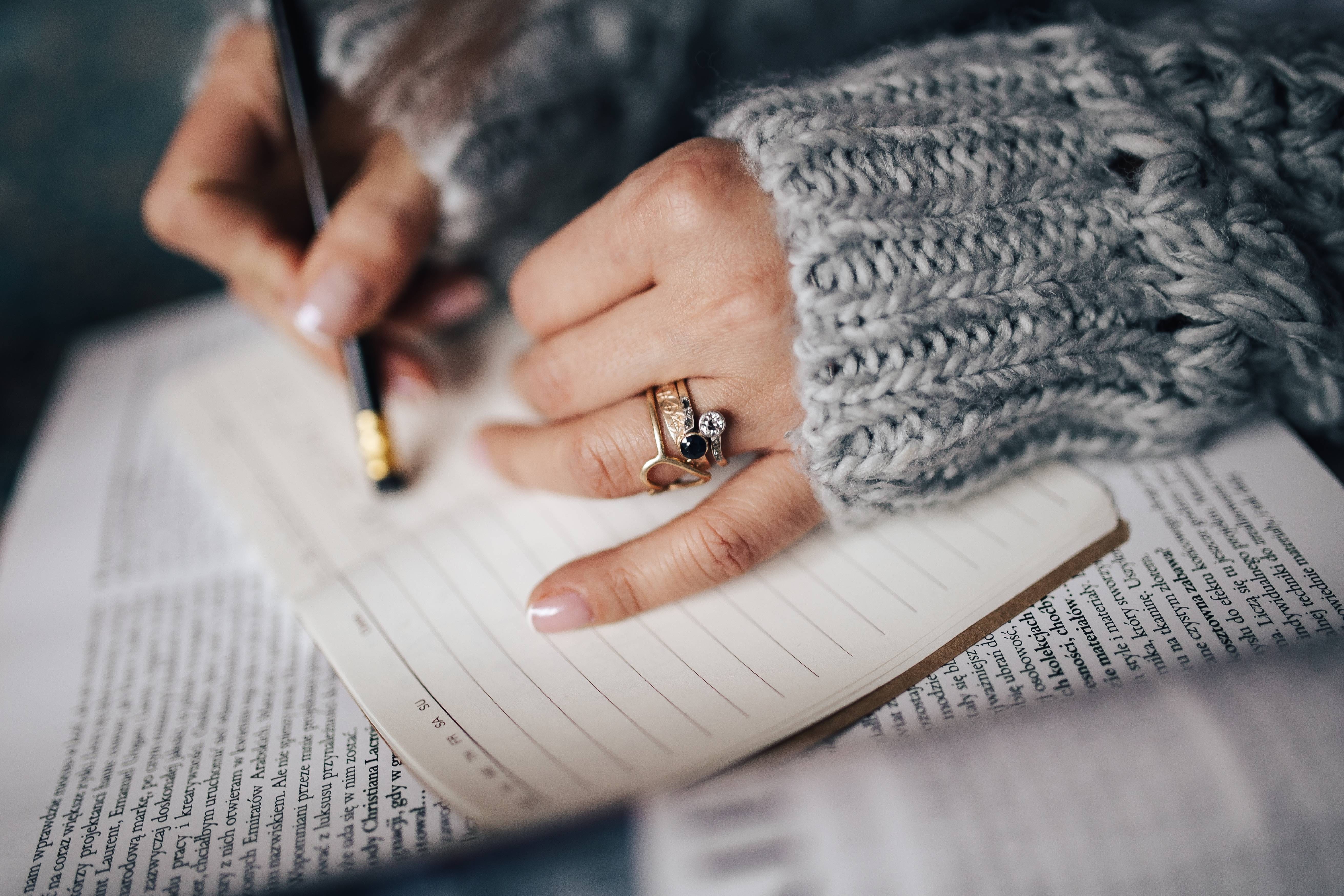 indoors, calendar, sweater, personal accessory, Woman, adults only, pen, notepad, one person, close-up, selective focus, holding, finger, ring, taking, HD Wallpaper