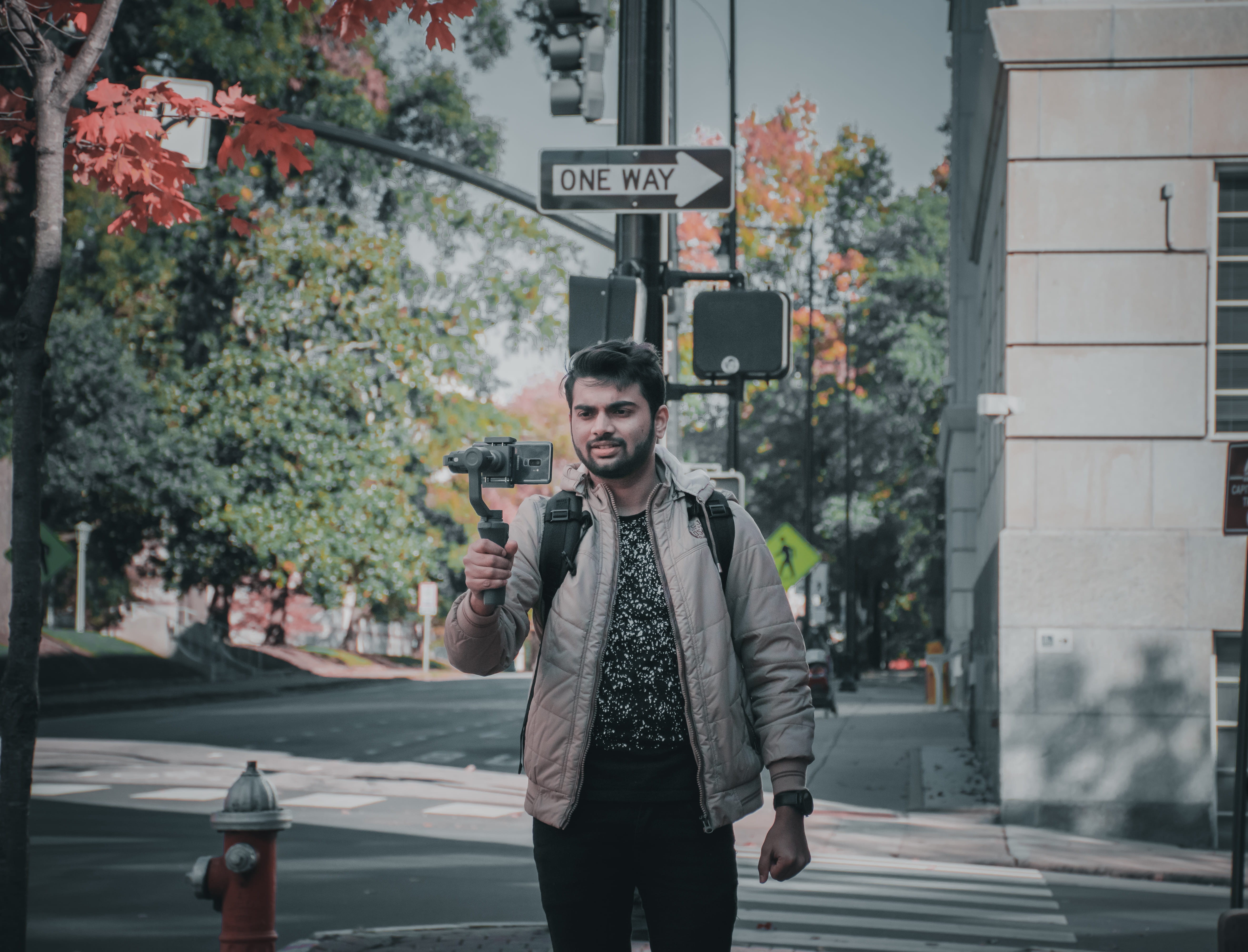 architecture, real people, s9plus, jacket, young adult, photography, street, communication, sign, casual clothing, mobile, handsome man, leisure activity, HD Wallpaper