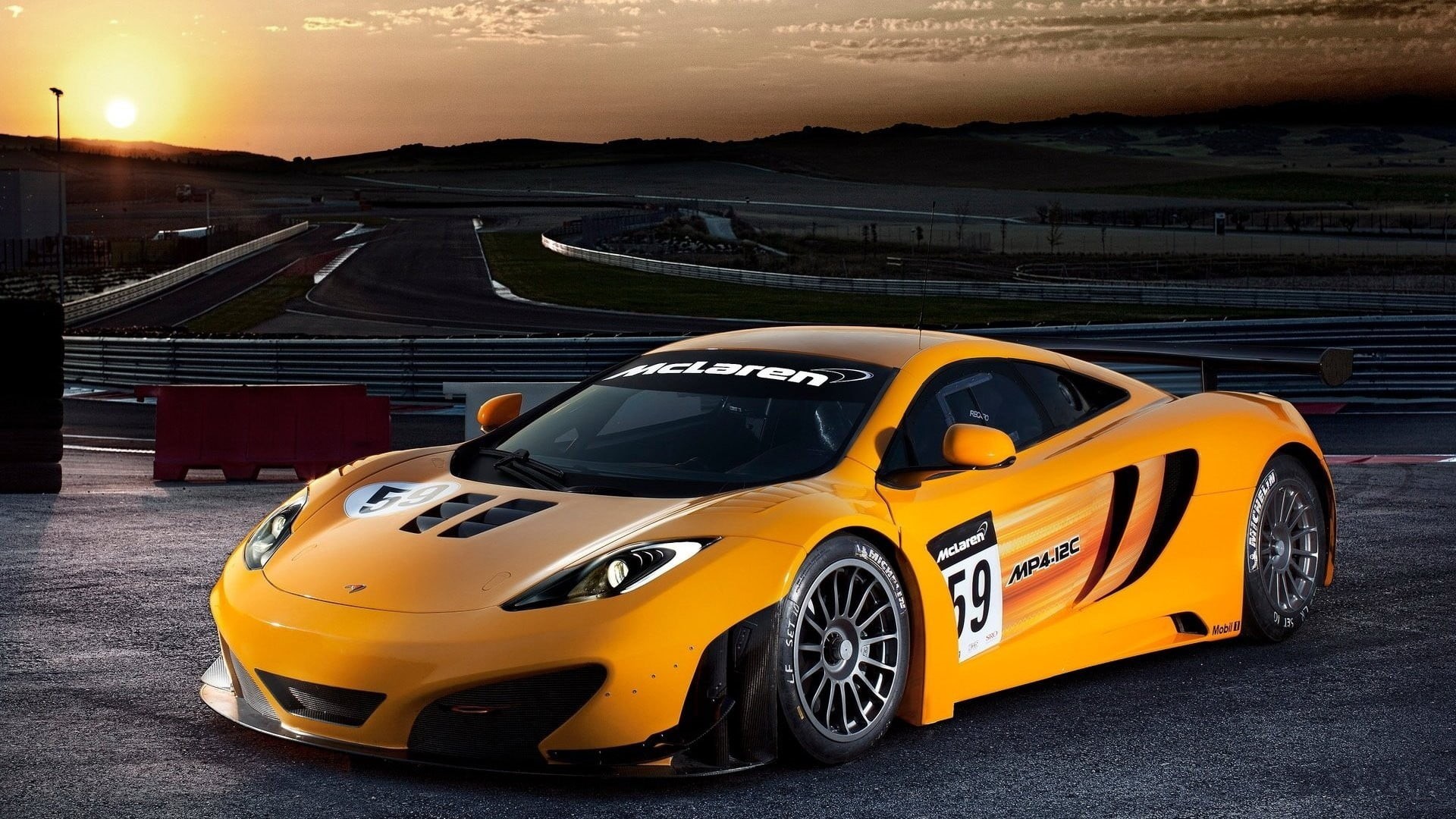 wheel, sports, orange cars, yellow, outdoors, mode of transportation, racecar, road, sport, street, motion, taxi, city, architecture, land vehicle, sunset, HD Wallpaper