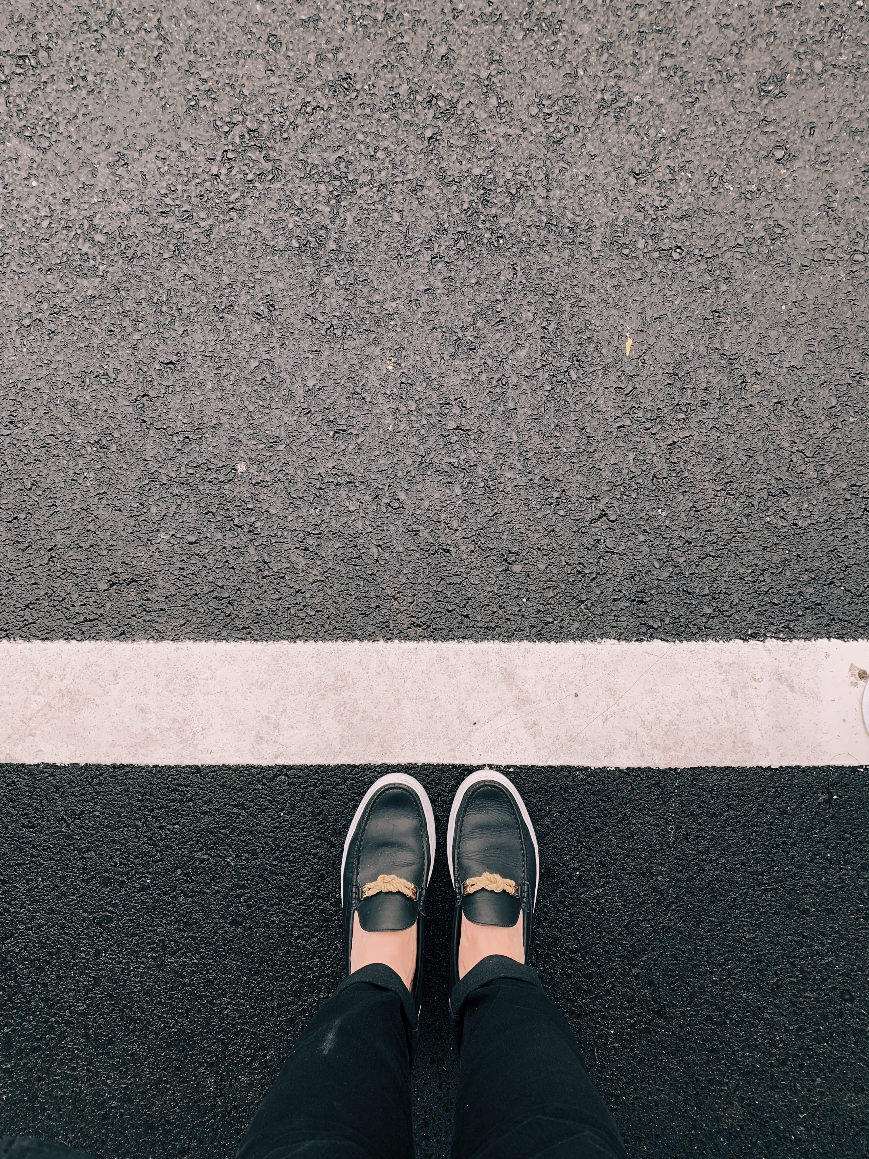 human limb, directly above, asphalt, apparel, person, outdoors, word, shoe, real people, body part, clothing, day, street, low section, denim, one person, Phone HD Wallpaper