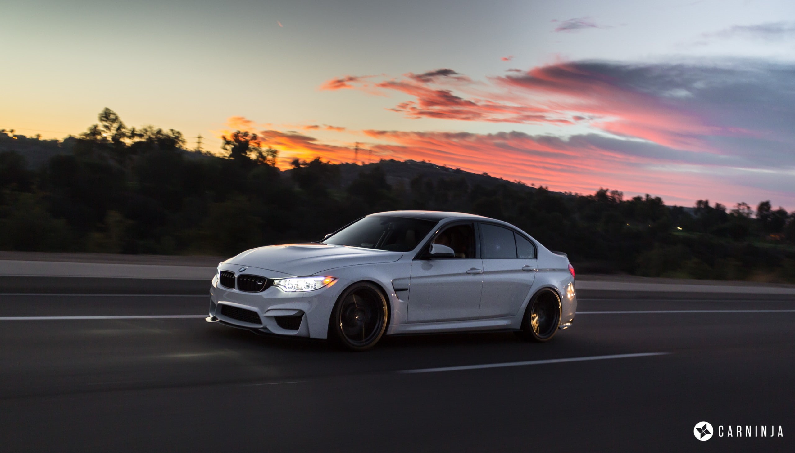 sunset, 2K, no people, orange color, Carninja, nature, road trip, sky, speed, luxury, motion, tree, land vehicle, plant, sunlight, street, transportation, HD Wallpaper