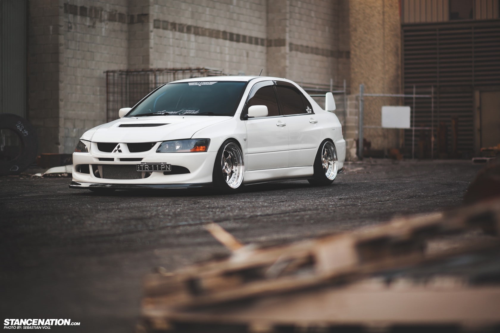 Mitsubishi Lancer EVO, architecture, selective focus, city, day, 720P, car, built structure, street, wheel, white color, road, toy, surface level, luxury, HD Wallpaper