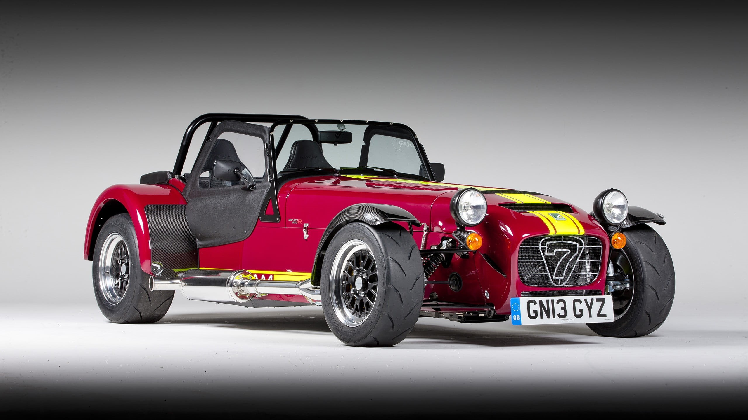 auto racing, black, Caterham, red, gray background, professional sport, mini, cooper, tire, people, sport, motorsport, studio shot, car, mode of transportation, HD Wallpaper