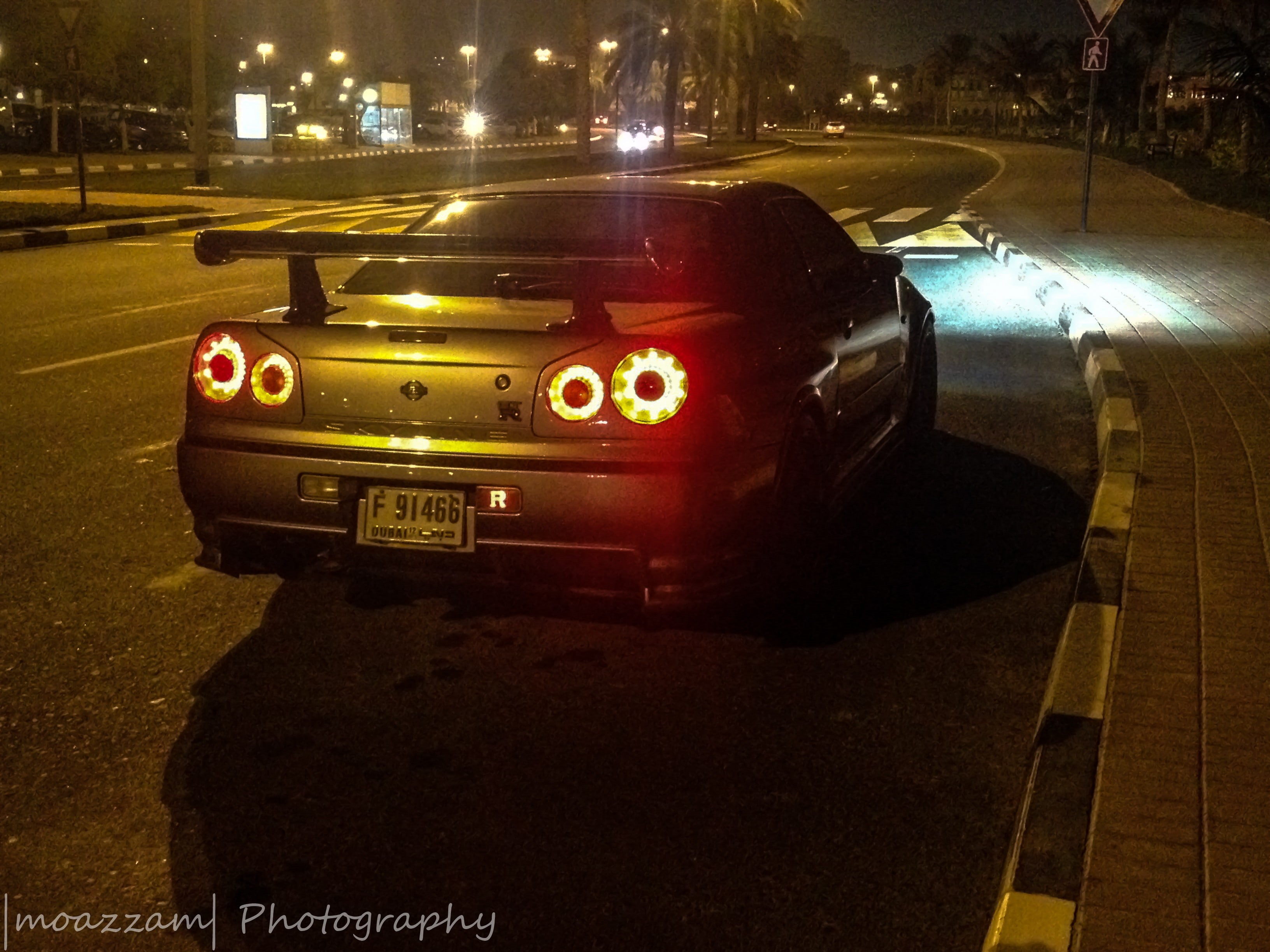 building exterior, street light, city, city street, travel, Nissan Skyline GT-R R34, motor vehicle, night, car, road, transportation, Nissan, 2K, no people, HD Wallpaper