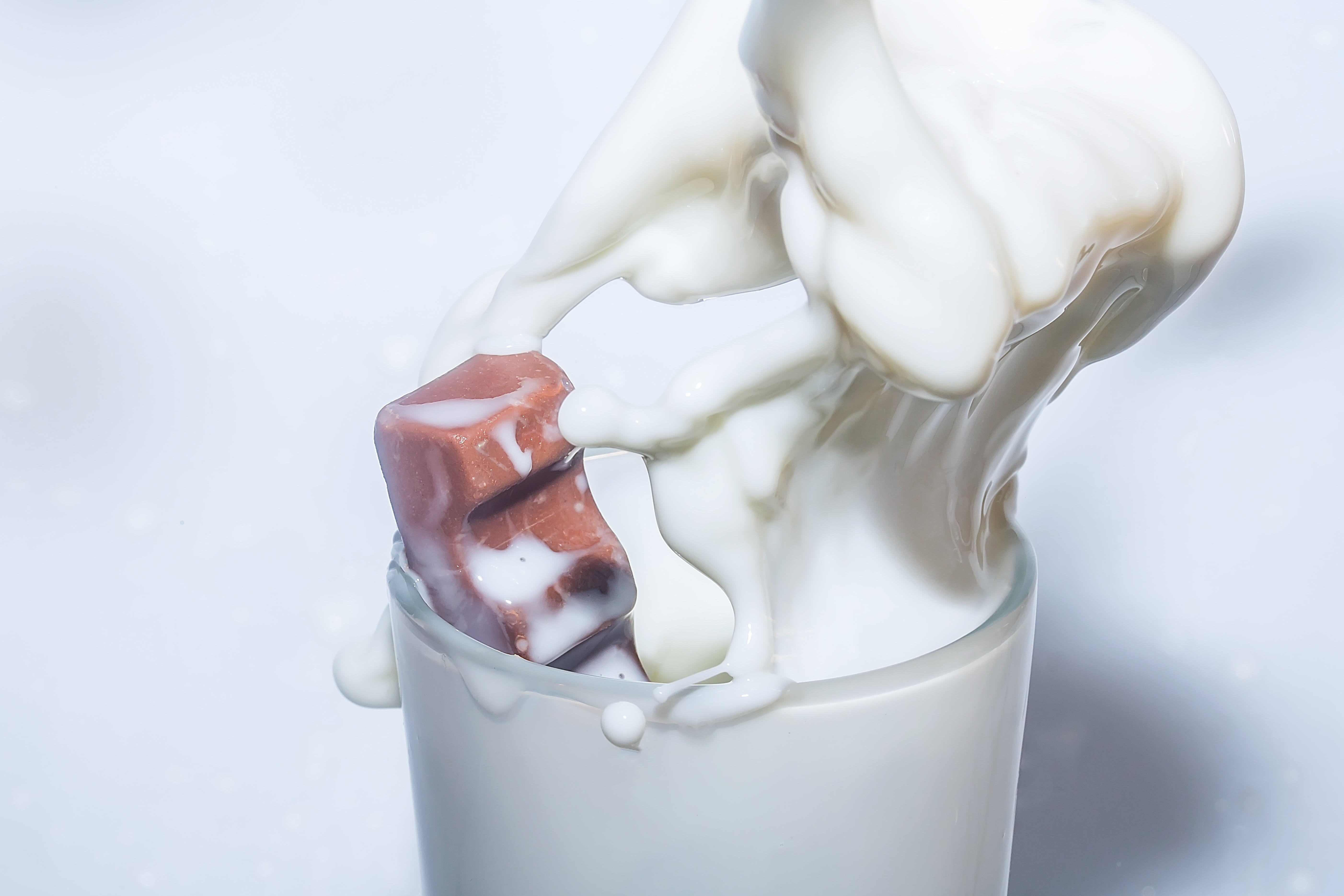 food, drip, macro, glass, human hand, frosted glass, sweet food, white, movement, yogurt, white background, milk, dessert, studio shot, spray, temptation, HD Wallpaper