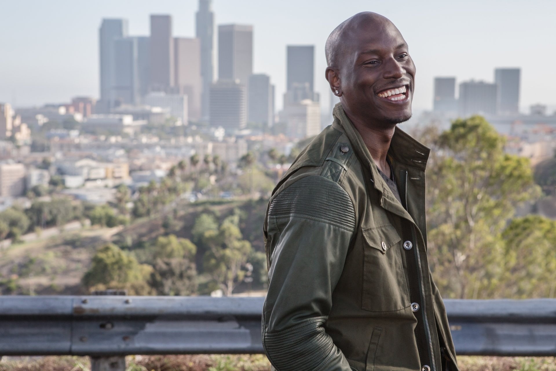 lifestyles, jacket, built structure, smiling, Roman Pearce, males, 1080P, leisure activity, railing, waist up, looking away, one person, real people, Fast and Furious, HD Wallpaper