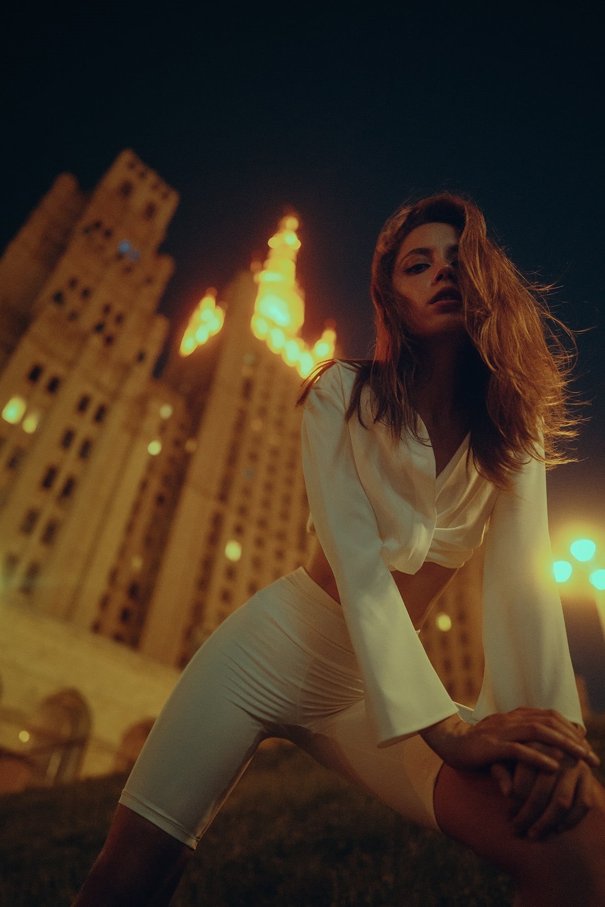 Yuriy Lyamin, long hair, low-angle, looking at viewer, Ksenia Kokoreva, women, building, brunette, 720P, night, white clothing, Phone HD Wallpaper