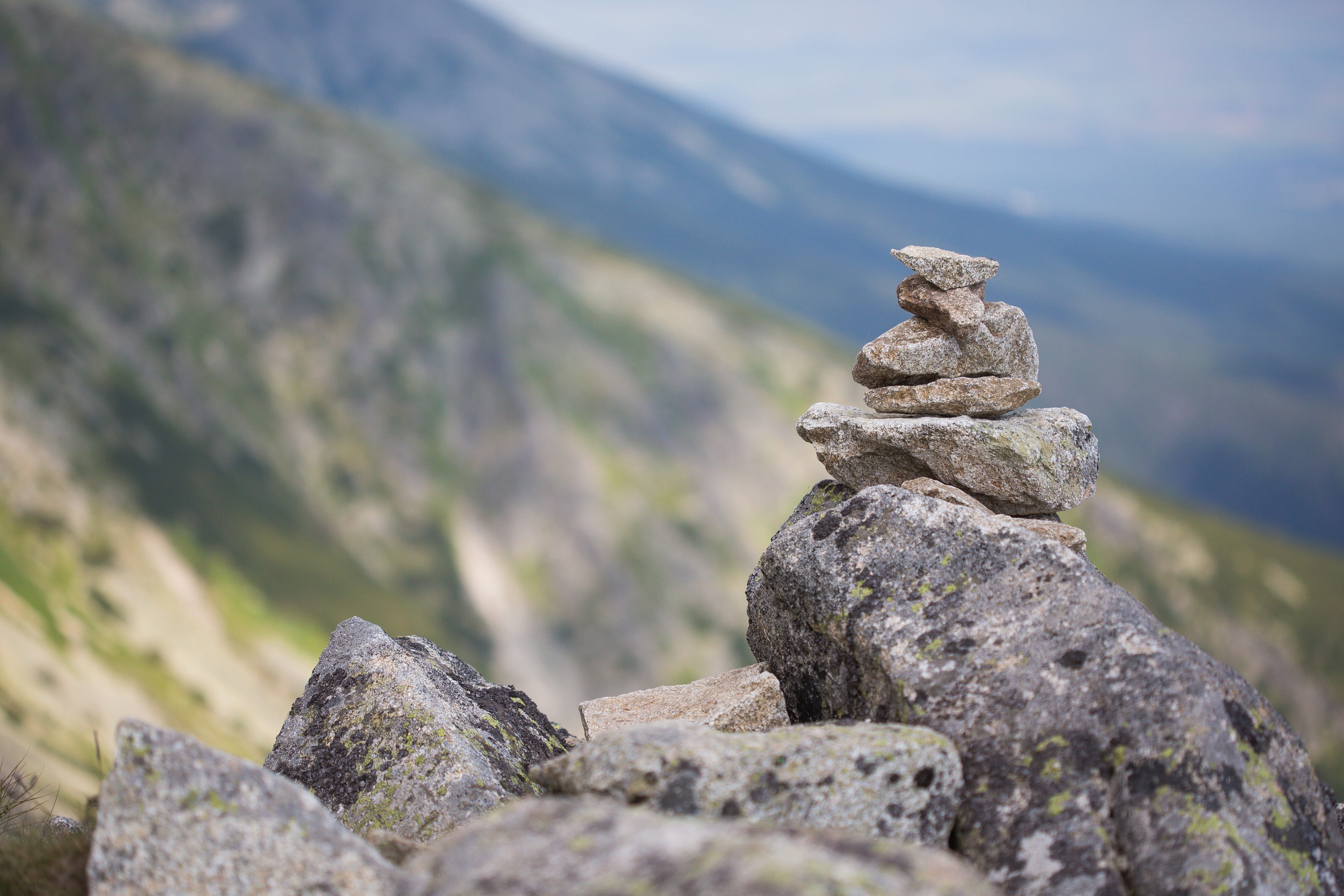 focus on foreground, mountain, stone, zen-like, art, landscape, nature, mystery, scenics, balance, stack, 4K, rocks, mountains, rock - Object, selective focus, HD Wallpaper
