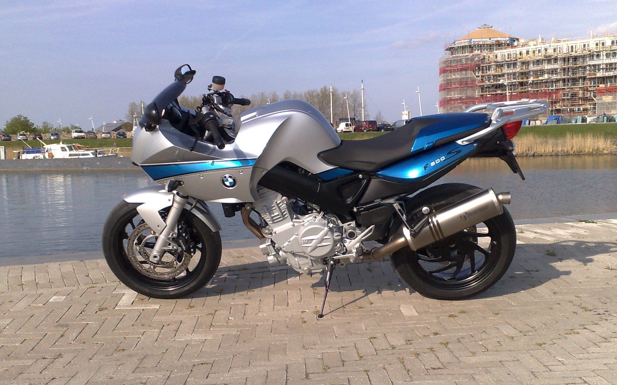 sports, city, no people, 1080P, vehicle, f-800, blue, water, nature, motor Scooter, scooter, gray, street, bike, built structure, sleek, sky, sharp, Bmw, HD Wallpaper