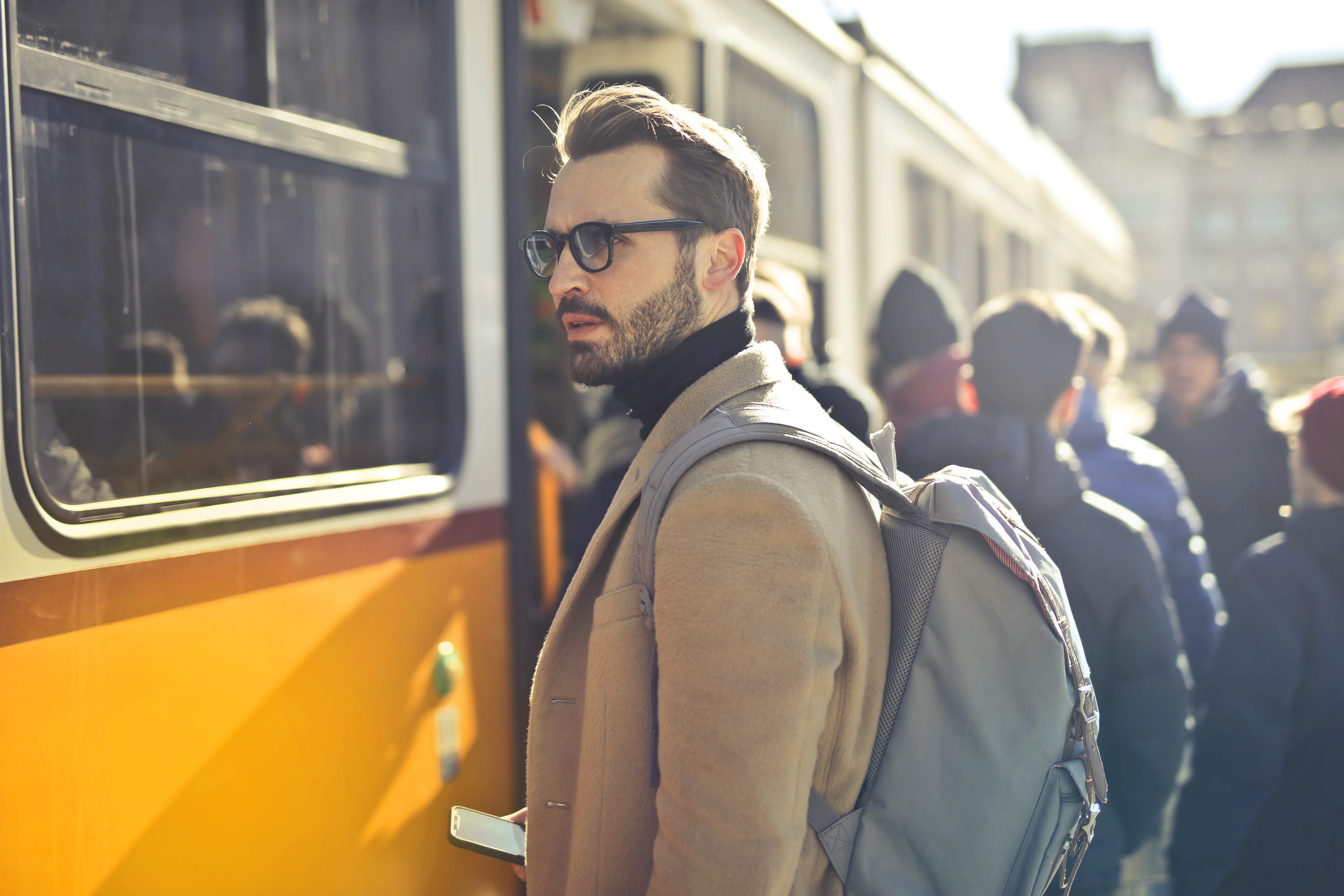 man, black sweater, black beard, boarding, backpack, stubble, phone in hand, tram, adult, station, glasses, city life, white, portrait, handsome, businessman, HD Wallpaper