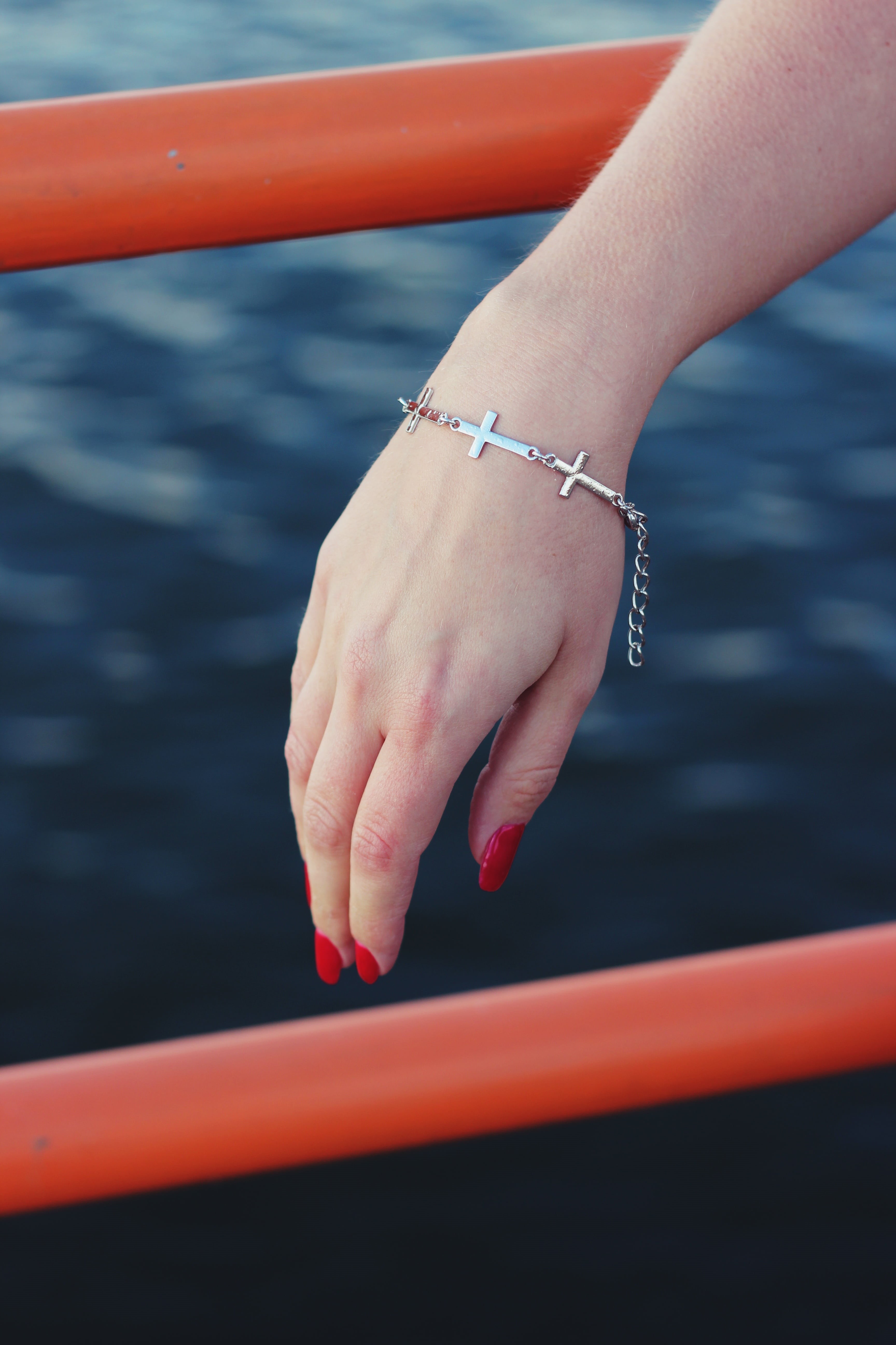 human finger, real people, close-up, sea, outdoors, water, high angle view, human body part, human Hand, adult, one person, hand, bracelet, finger, nature, Phone HD Wallpaper