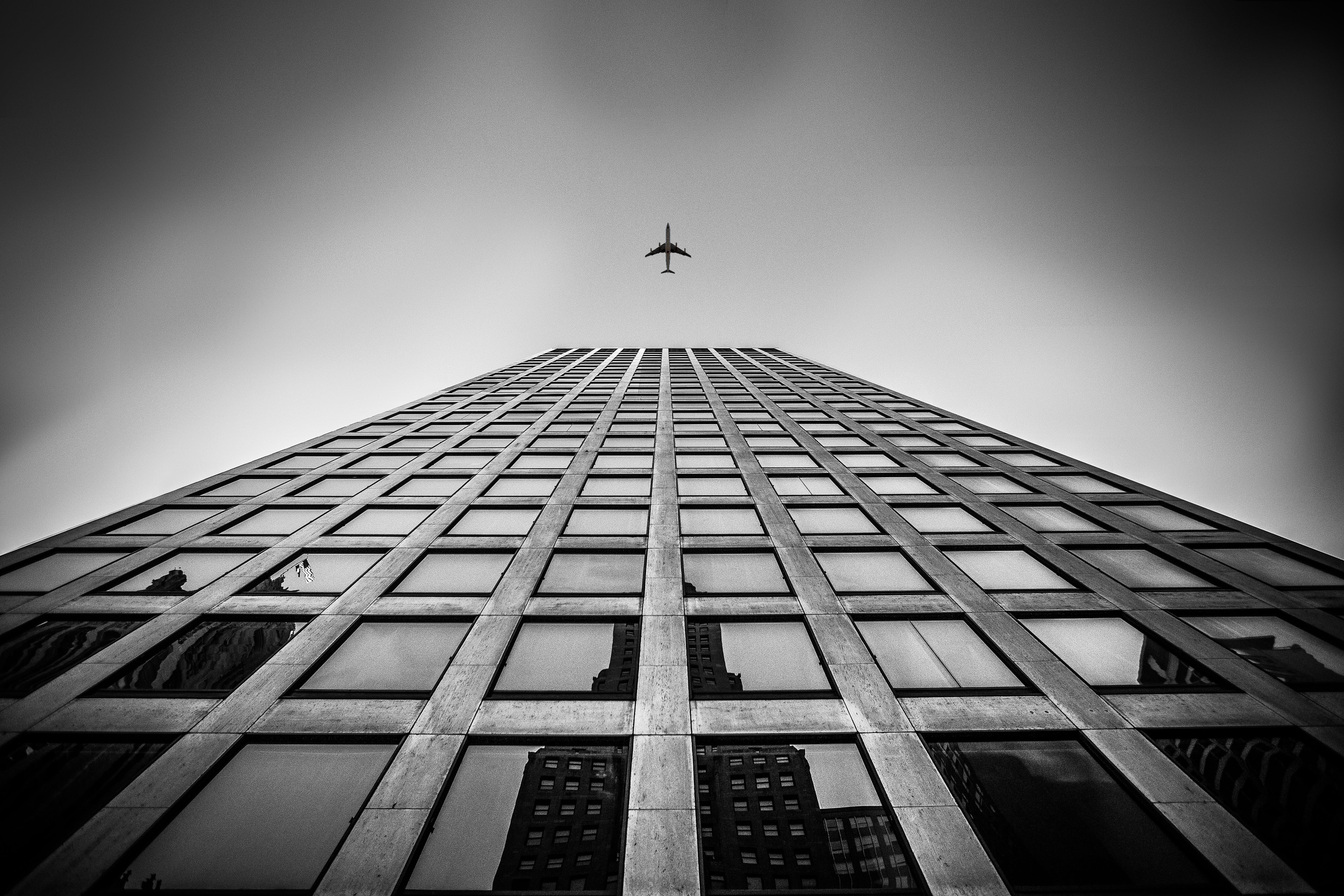 modern, no people, clear sky, sky, mid-air, 5K, angle, low, transportation system, built structure, travel, skyscraper, outdoors, low angle view, aircraft, HD Wallpaper