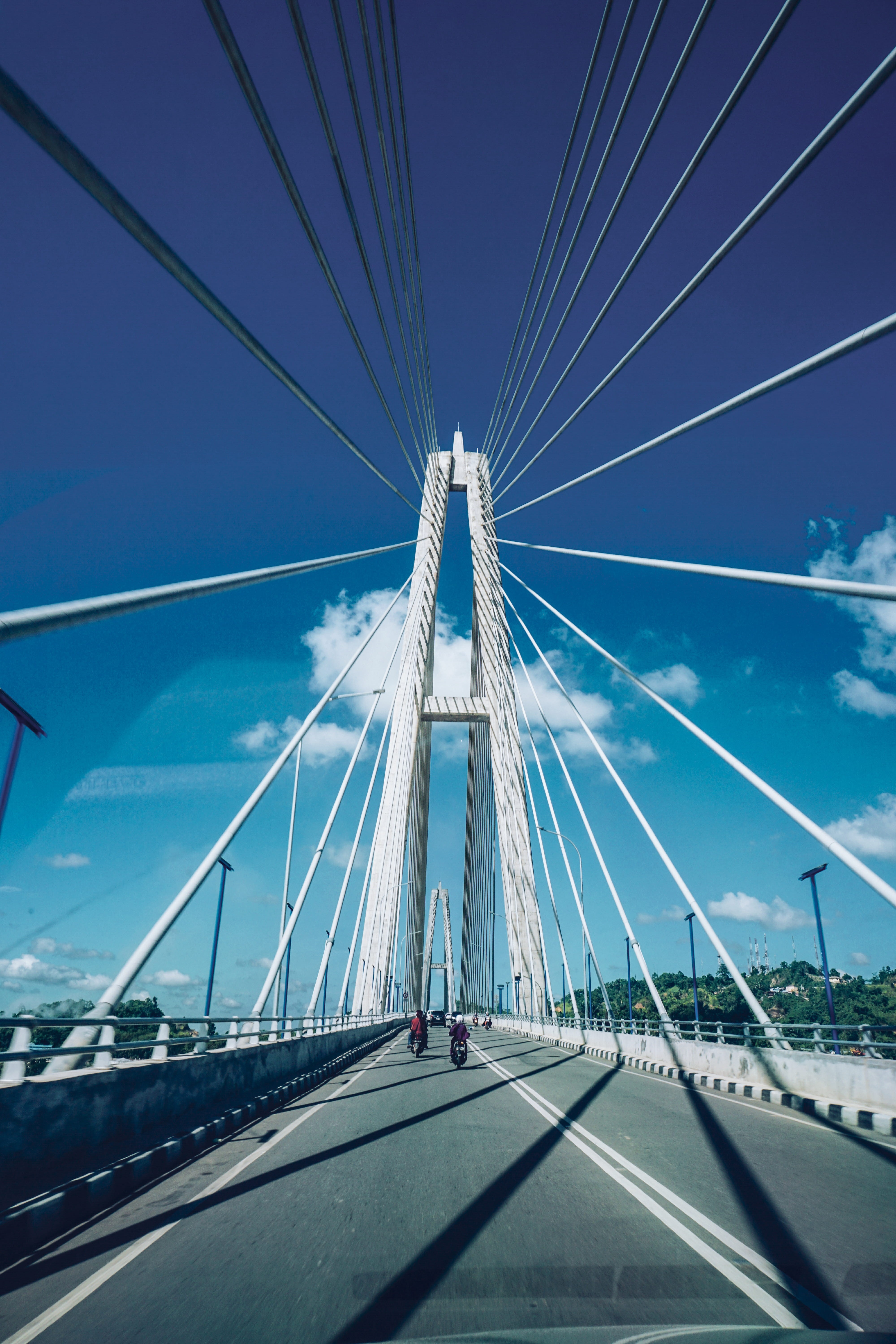 suspension bridge, bridge - man made structure, government, bridge, direction, diminishing perspective, road, day, built structure, kalimantan timur, cable, Phone HD Wallpaper