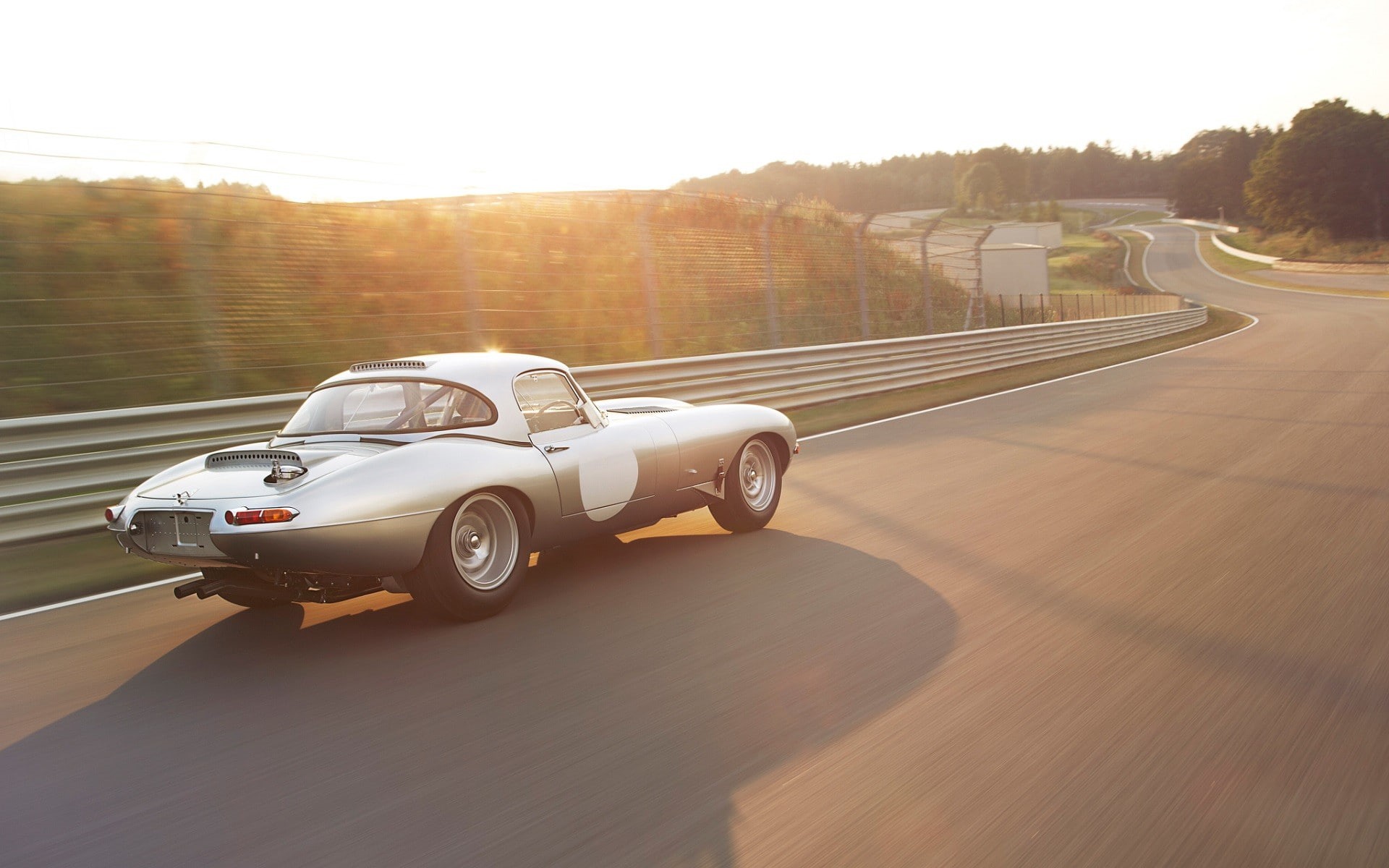 speed, road, nature, sunlight, sky, sports race, clear sky, Jaguar, no people, transportation, land vehicle, plant, day, motion, road trip, car, tree, city, HD Wallpaper