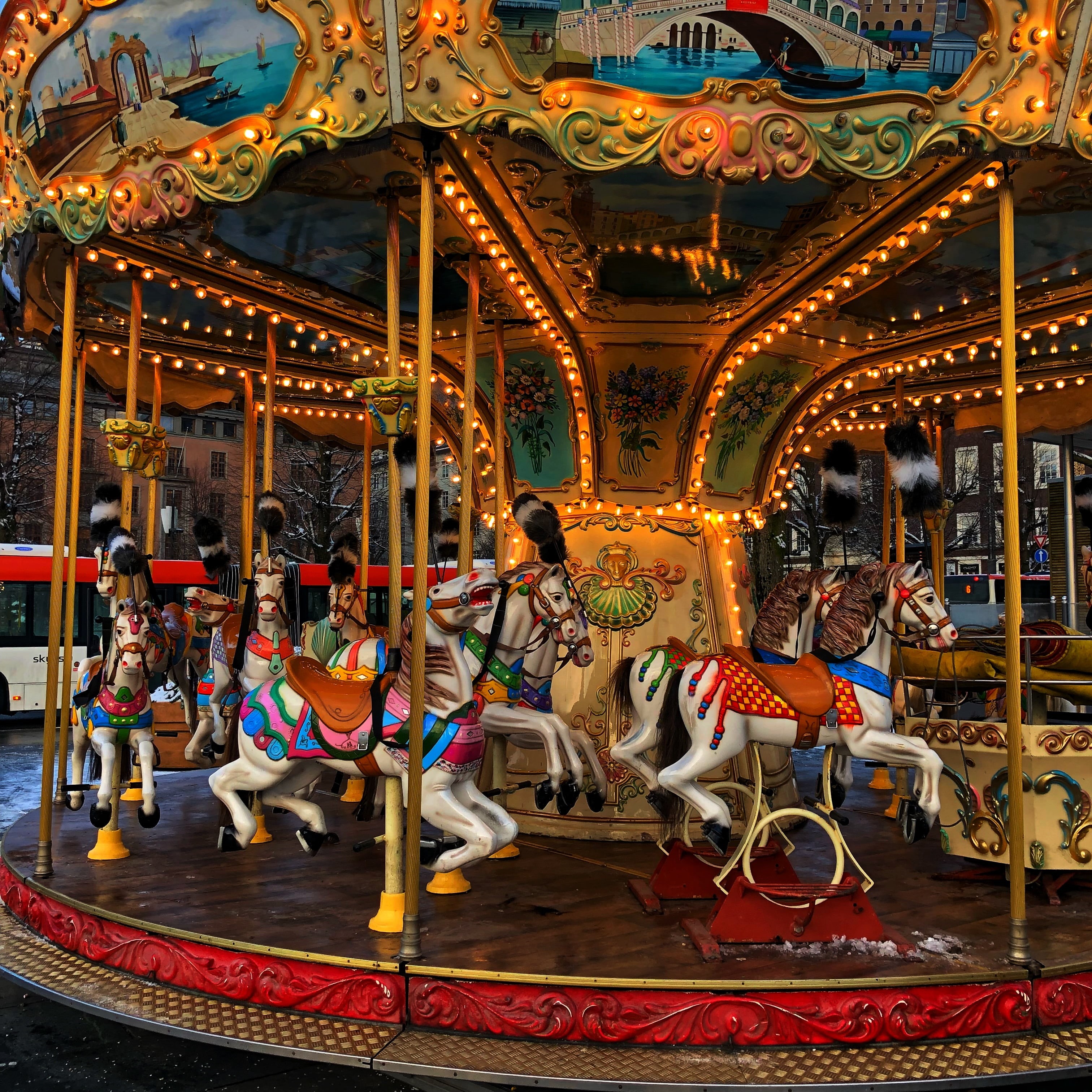 sitting, enjoyment, fun, amusement park, arts culture and entertainment, livestock, domestic animals, animal, carousel, group of people, carousel horses, Phone HD Wallpaper