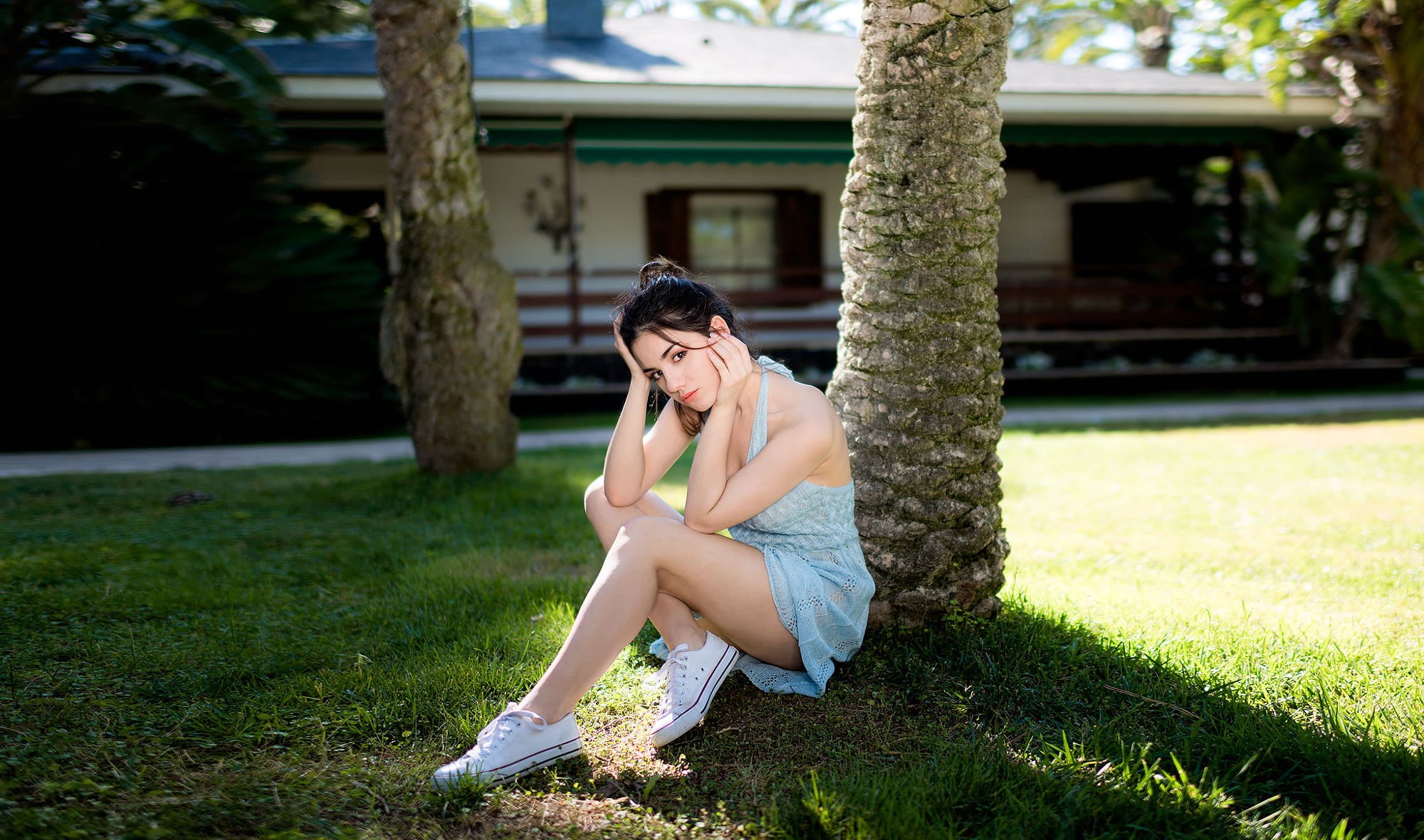 dark eyes, grass, sneakers, hairstyle, lifestyles, sitting, one person, young adult, brunette, outdoors, beautiful woman, day, minidress, hand on face, HD Wallpaper