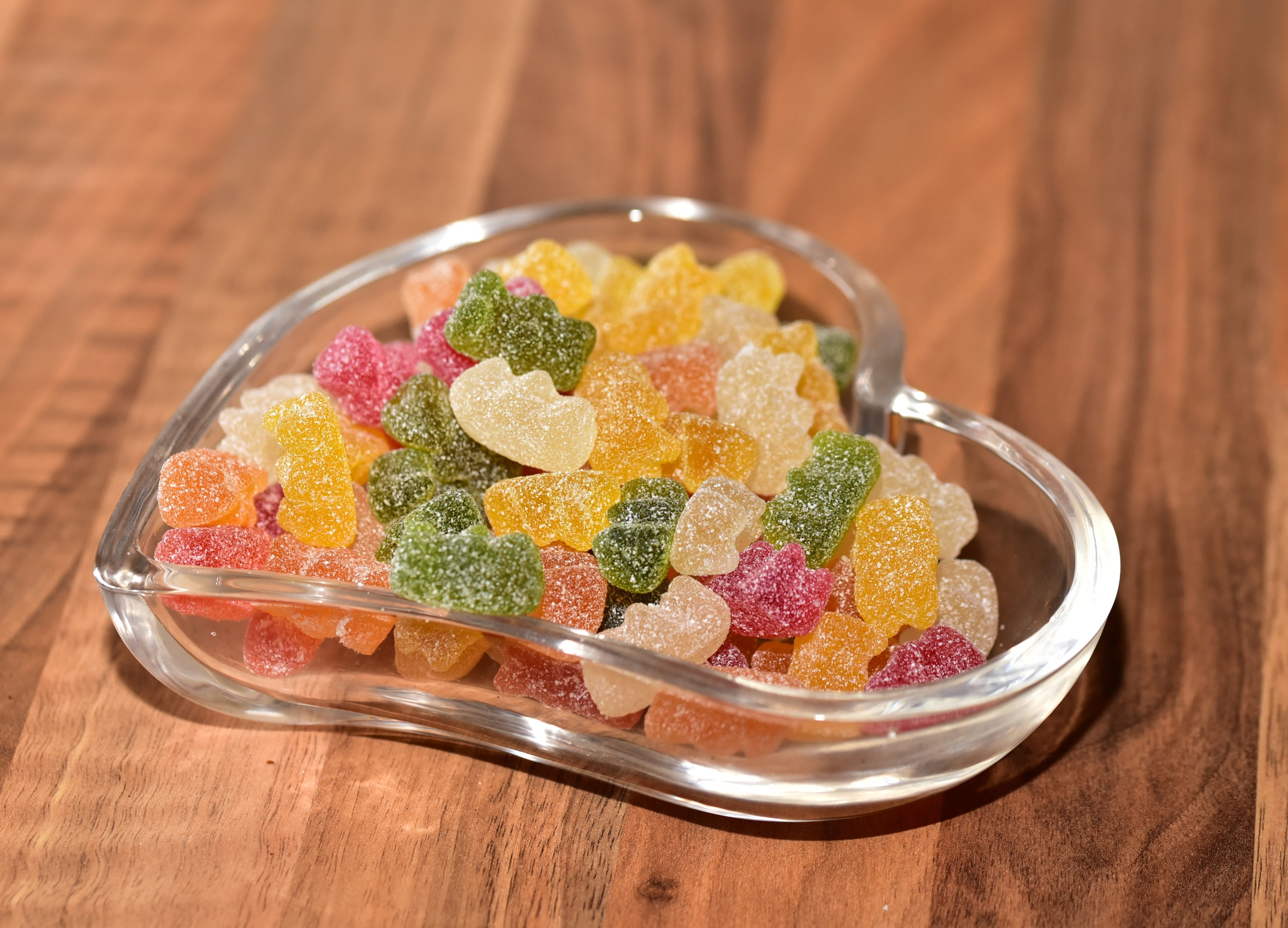 glass, studio shot, food and drink, indoors, candy, sour, heartbeat, candies, table, fruit jelly, color, food, sweet food, wood - material, vegetable, variation, HD Wallpaper