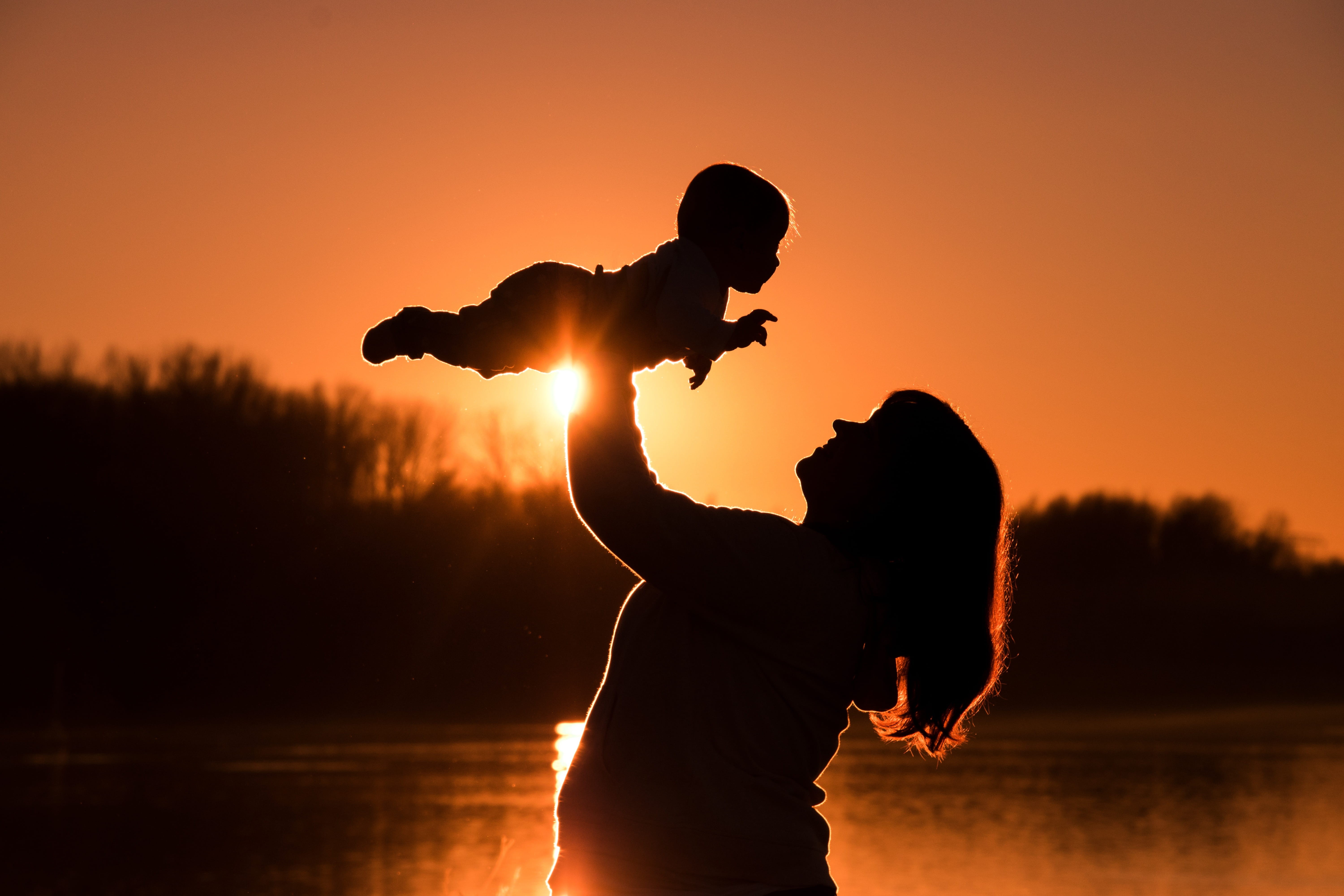 silhouette, mother, sunlight, emotion, nature, positive emotion, water, adult, sunset, boy, togetherness, orange color, woman, trust, beauty in nature, HD Wallpaper