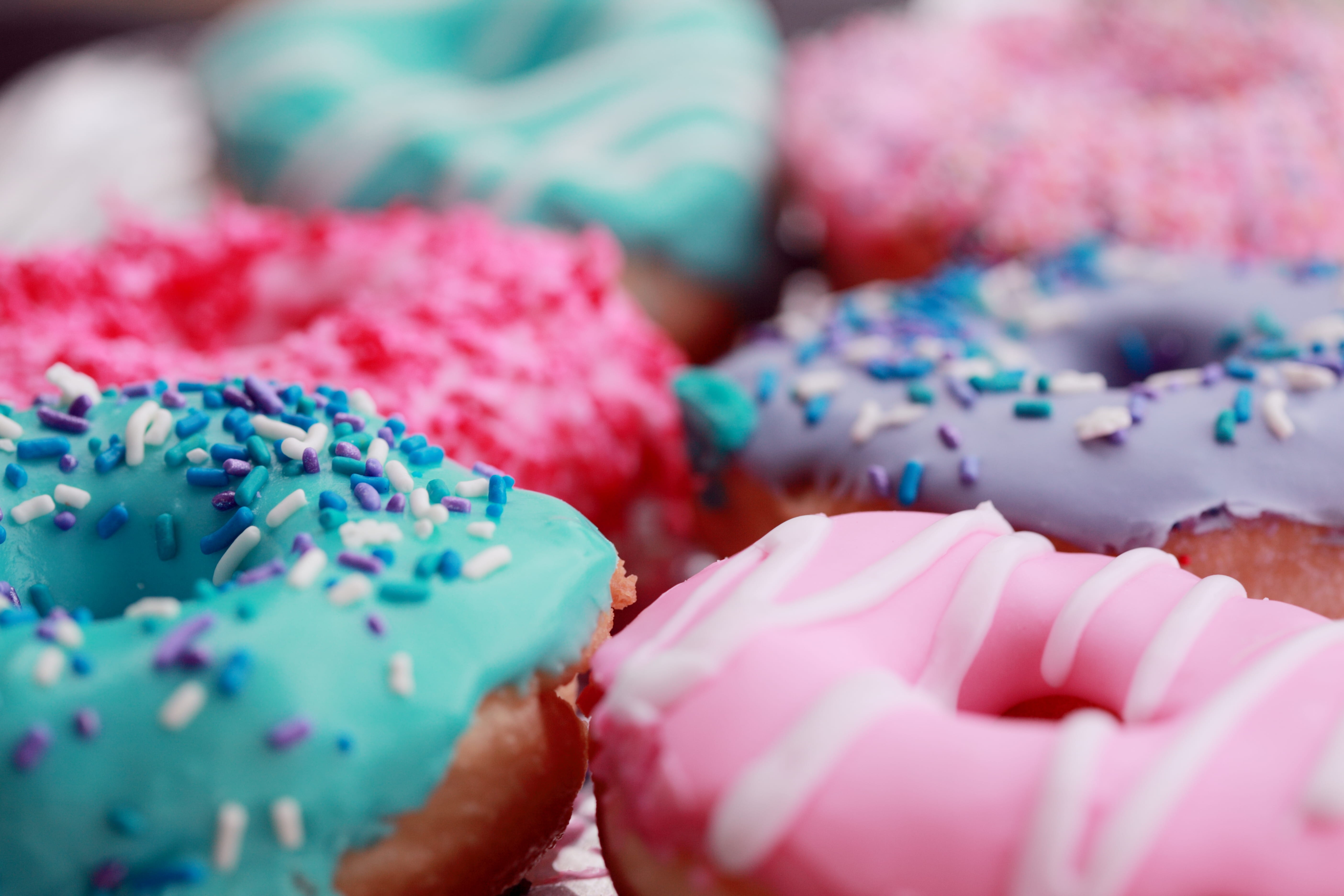assorted, doughnut, icing, photography, cupcake holder, shallow, variety, unhealthy eating, dessert, sweet food, 5K, pink color, selective focus, baked, HD Wallpaper