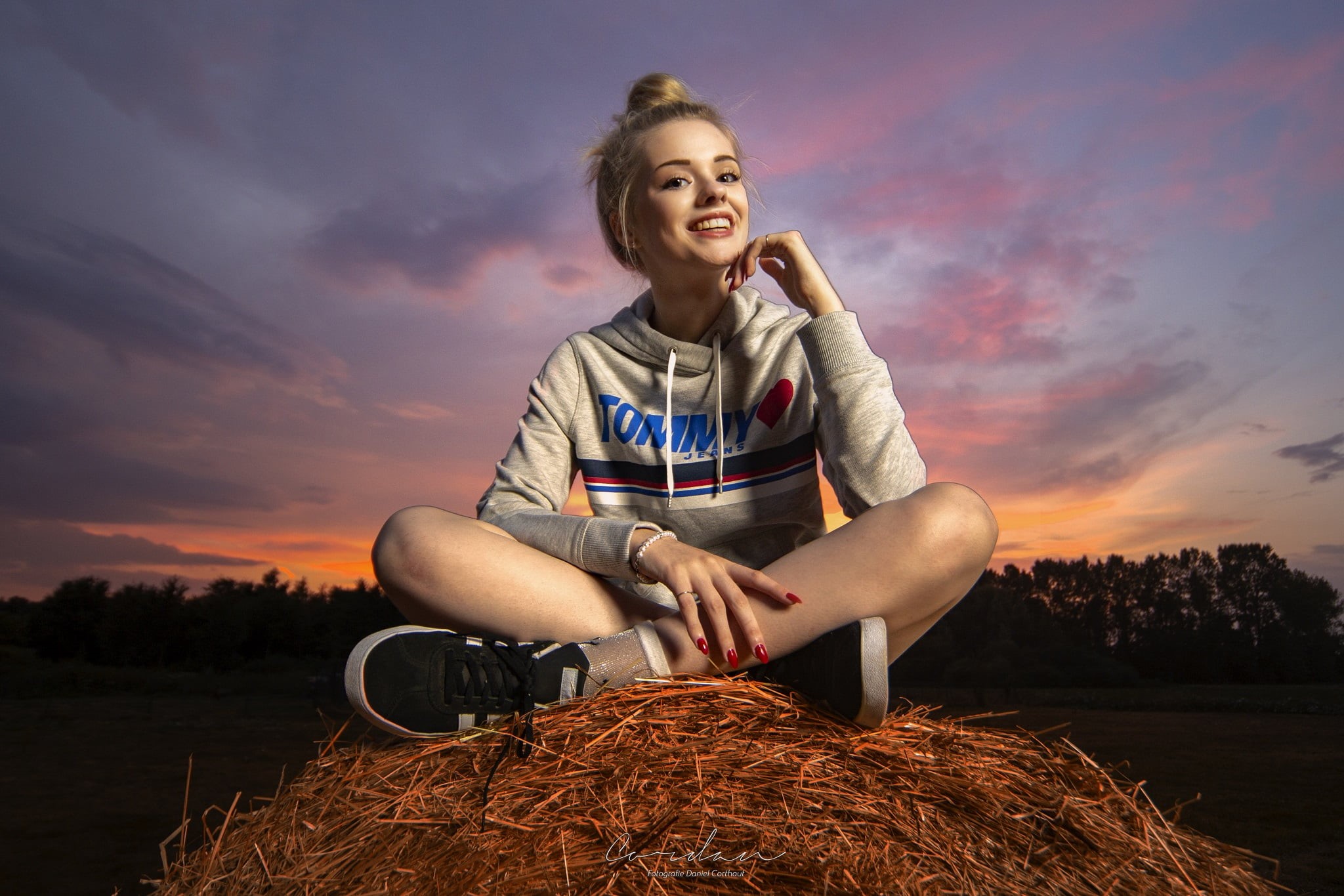 field, gray, women outdoors, looking away, cloud - sky, nature, front view, outdoors, hay, s, looking at viewer, real people, smiling, legs crossed, women, HD Wallpaper