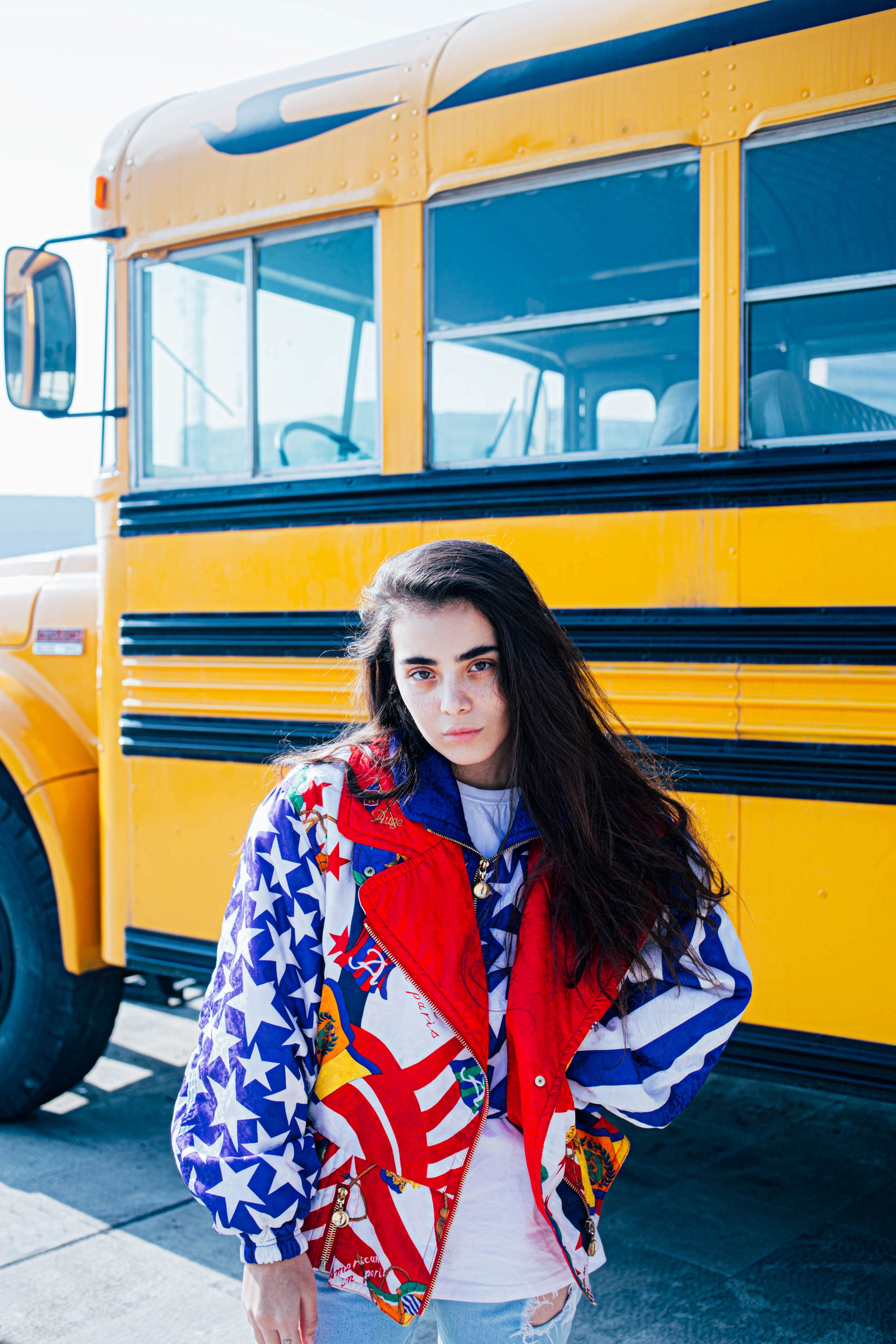 beauty, bus, school bus, long hair, adult, bumper, ornament, lifestyles, outdoors, jacket, day, clothing, looking at camera, one person, young women, apparel, Phone HD Wallpaper
