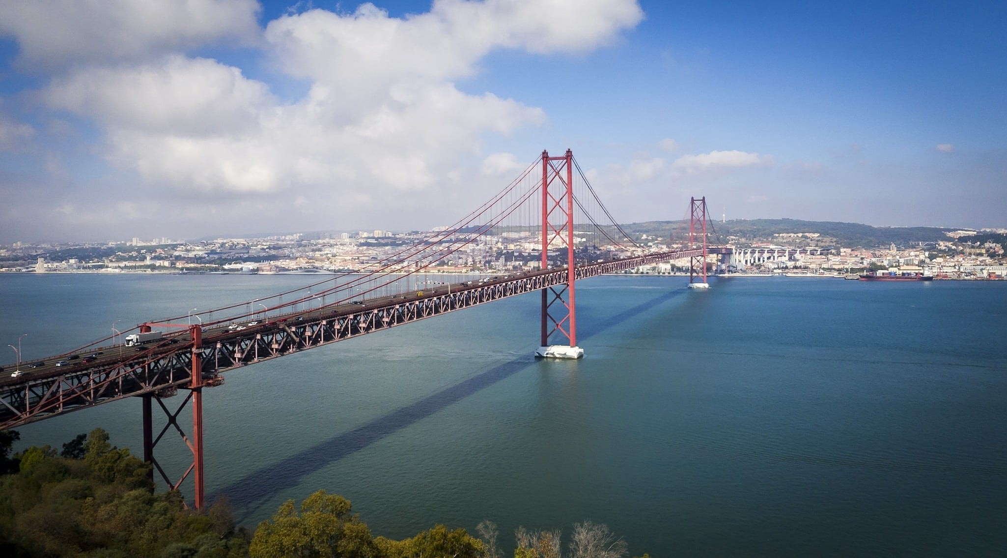 building exterior, architecture, bridge, tourism, outdoors, travel destinations, connection, built structure, cityscape, city, sea, lisbon, 1080P, engineering, HD Wallpaper