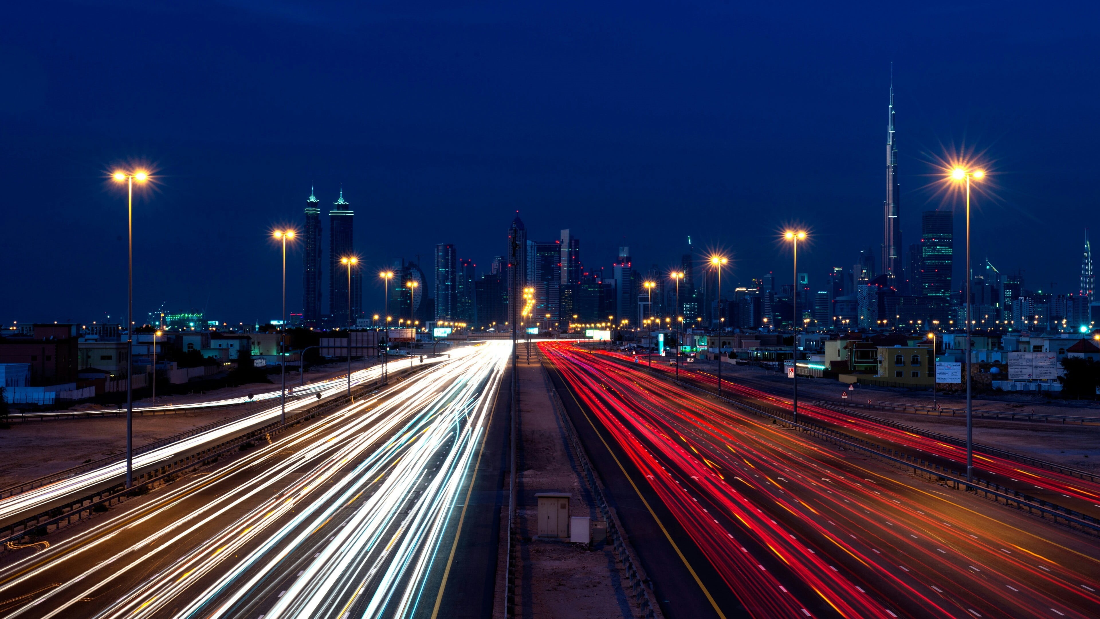 no people, long exposure, transportation, architecture, multiple lane highway, outdoors, built structure, building exterior, skyscraper, Dubai, speed, night, HD Wallpaper