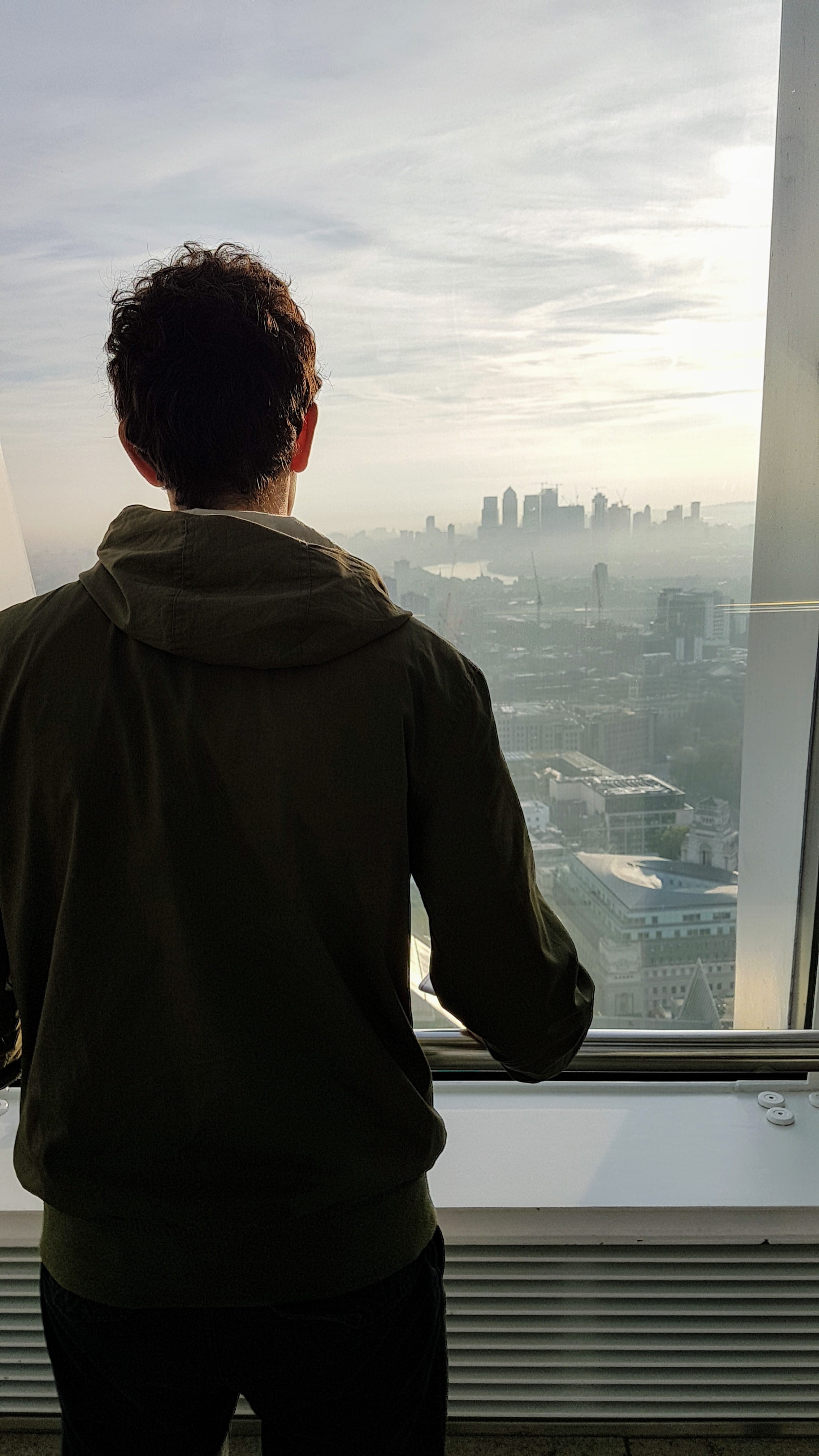glass - material, lifestyles, 4K, back view, jacket, indoors, man, day, outfit, built structure, nature, cloud - sky, office, three quarter length, light, Phone HD Wallpaper