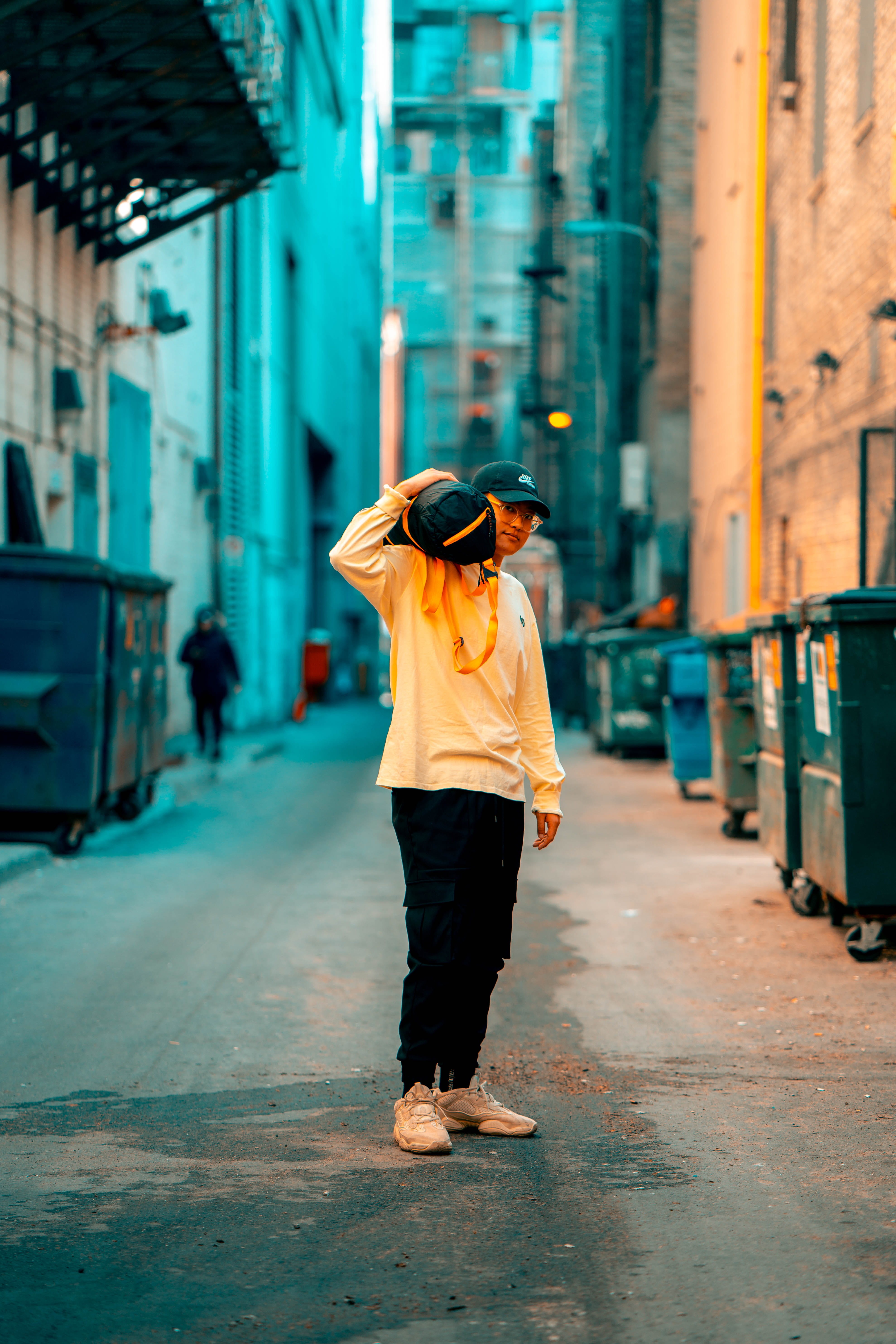 daylight, building exterior, one person, black, casual clothing, built structure, man, holding, person, full length, outdoors, leisure activity, photoshoot, Phone HD Wallpaper