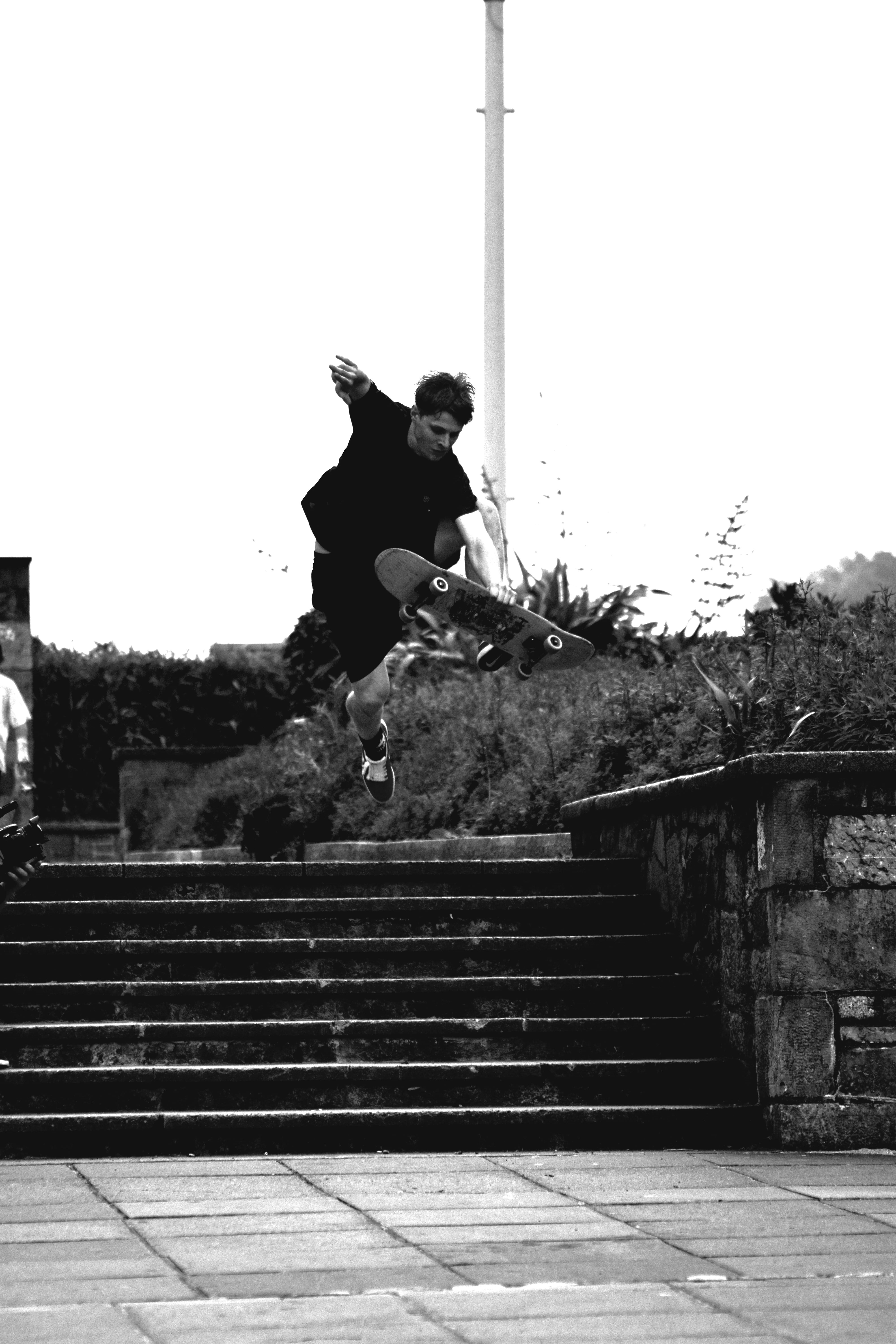 grayscale, skater, hobby, skateboarder, photo, one person, sport, men, tricks, staircase, lifestyles, real people, jumping, clear sky, action, motion, man, Phone HD Wallpaper
