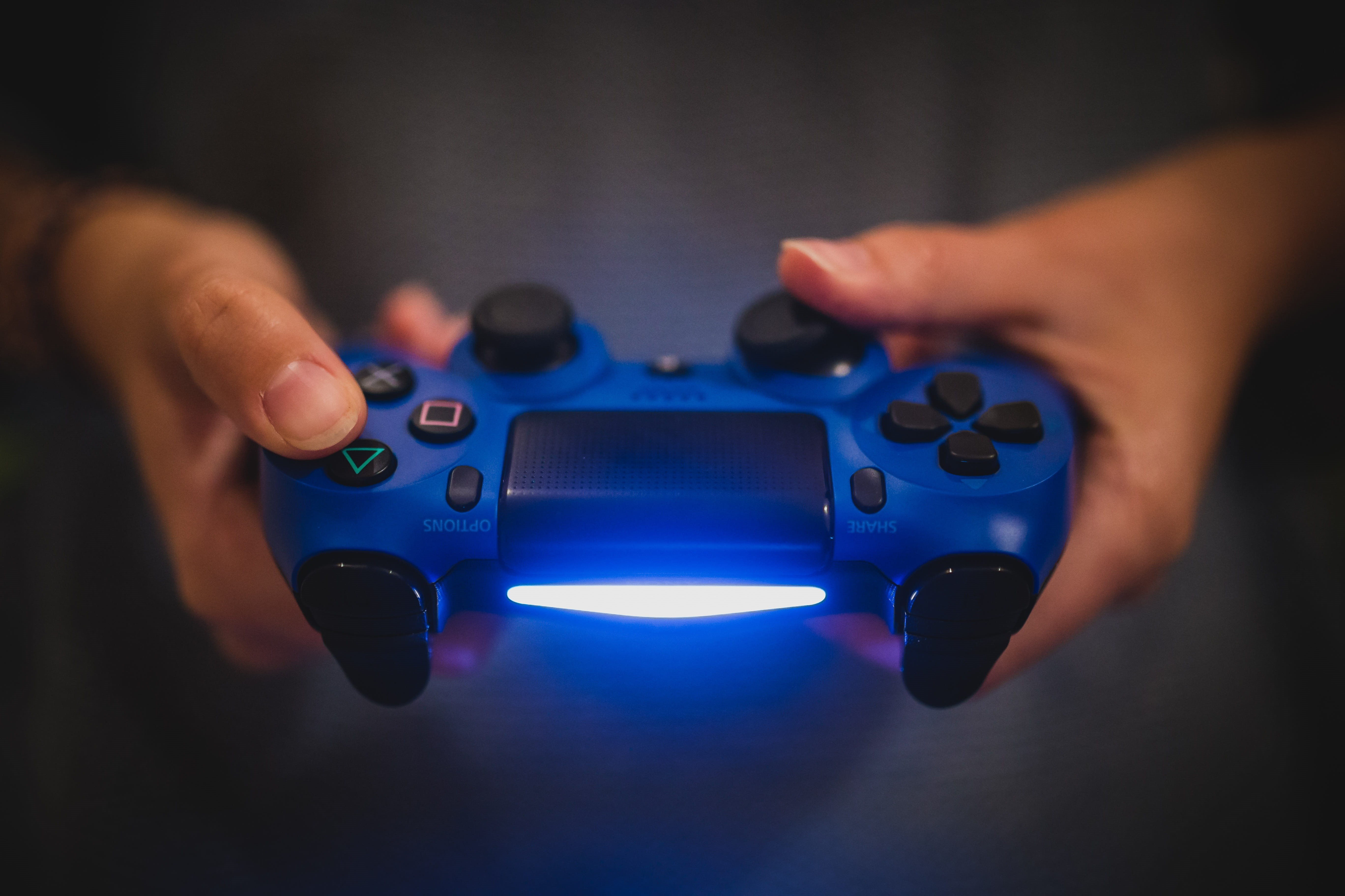 toy, video games, one person, studio shot, 5K, gaming, human finger, ps4, close-up, controller, finger, holding, indoors, person, playstation, human hand, HD Wallpaper