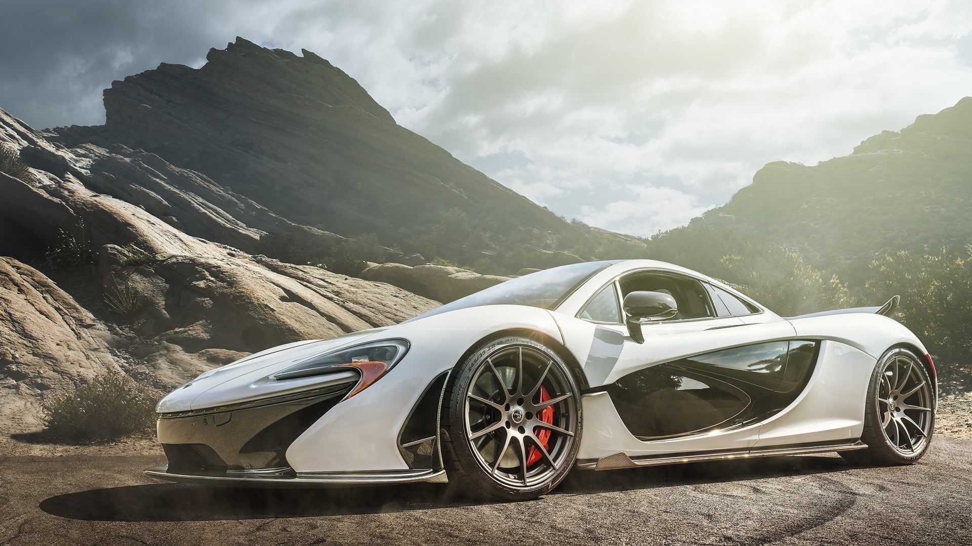 day, sunlight, motor vehicle, supercar, sky, luxury, no people, non-urban scene, cloud - sky, beauty in nature, mountain, McLaren P1, wheel, land vehicle, HD Wallpaper